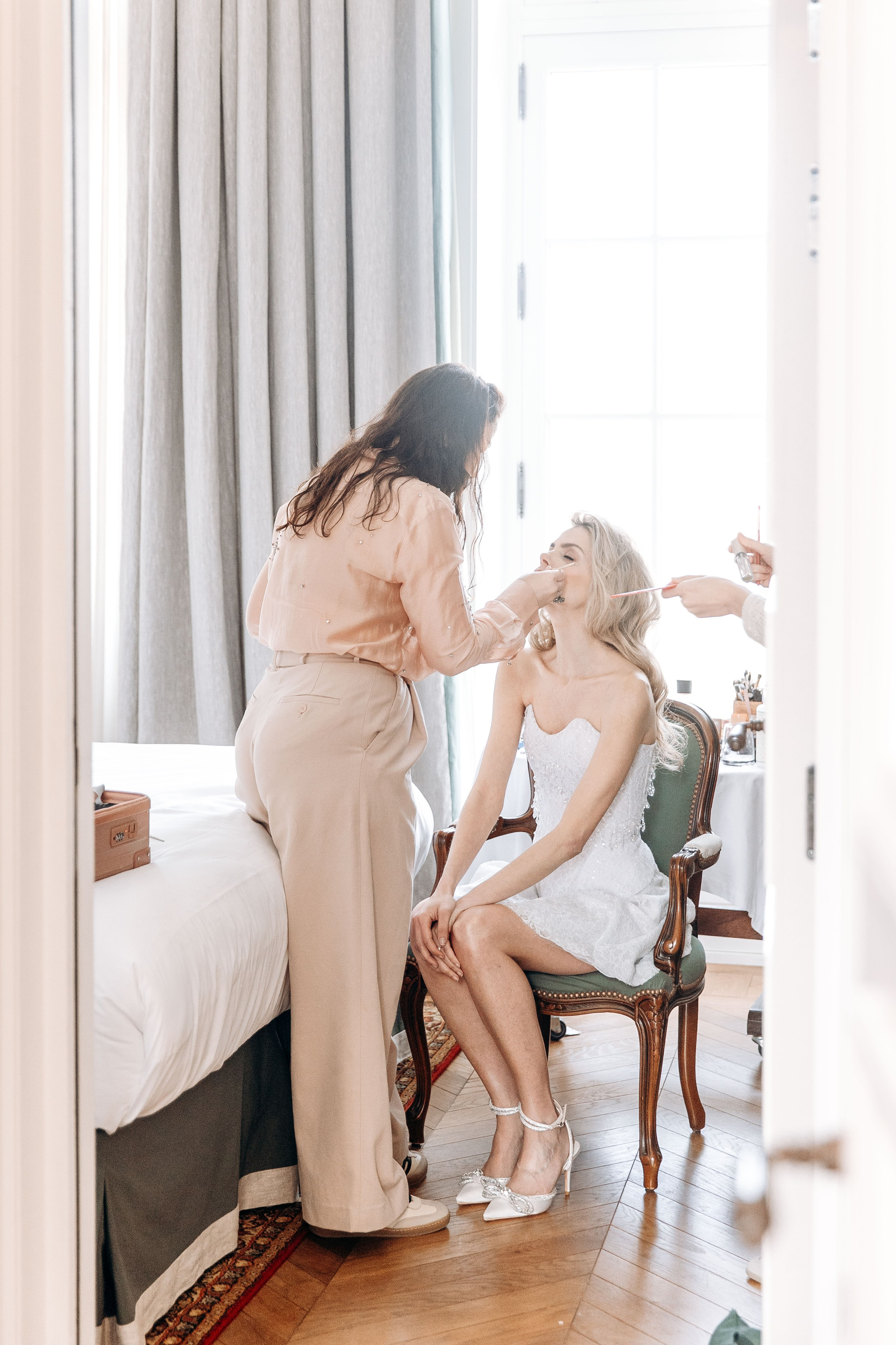 The bride is getting ready for a wedding celebration in a French chateau. 