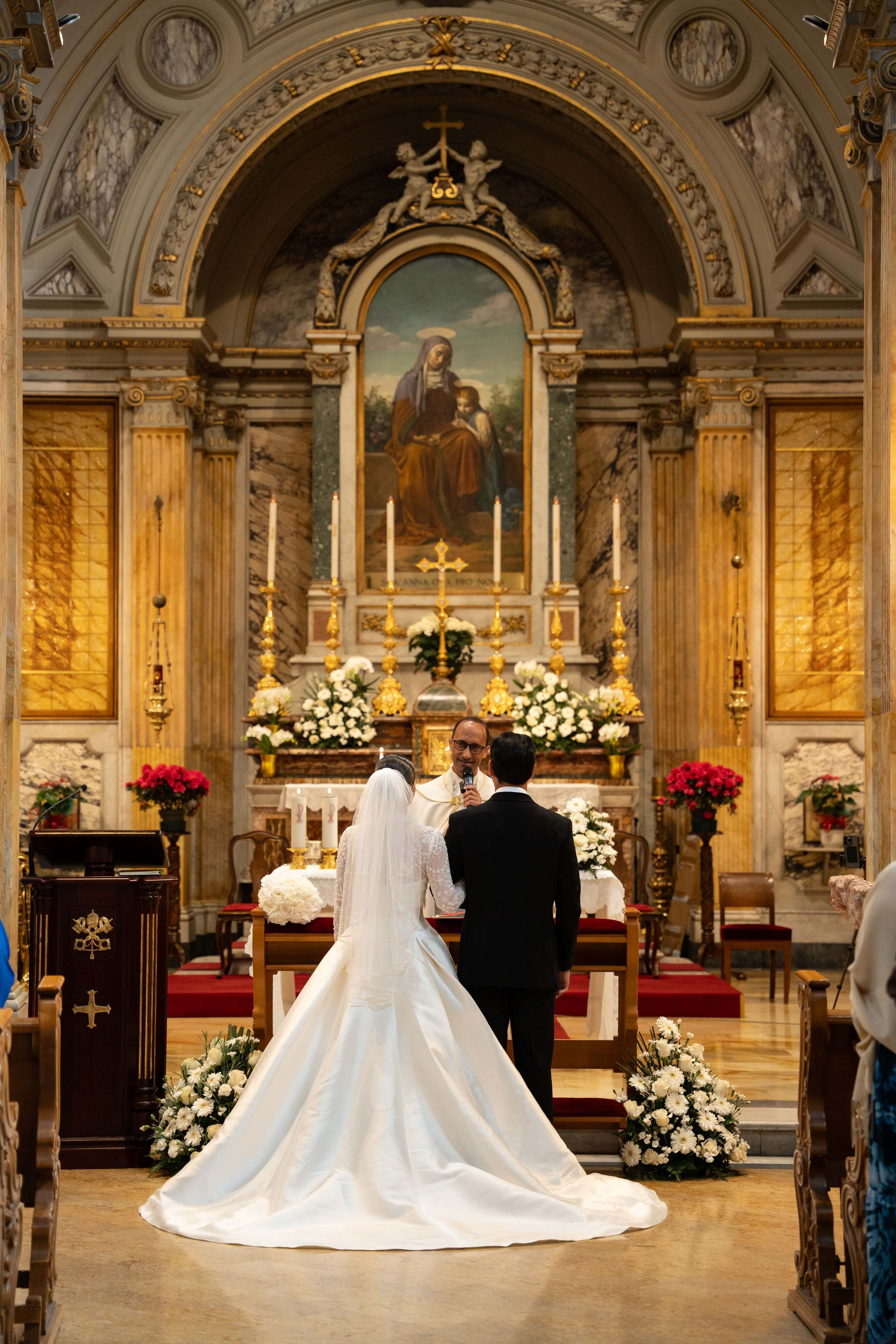 bride and groom in front of the altar in Vatican