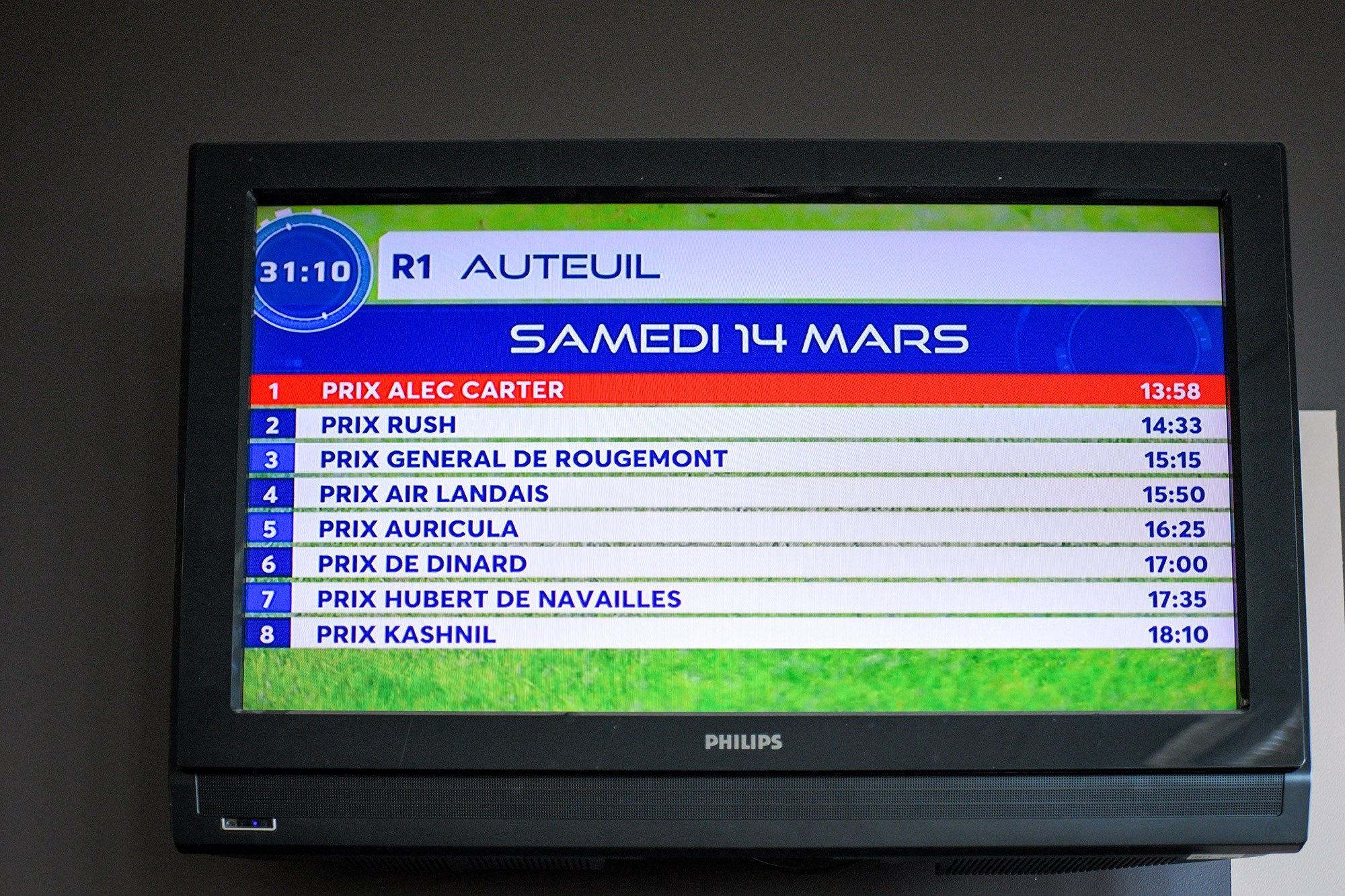 Horse racing schedule screen at Hippodrome d’Auteuil in Paris