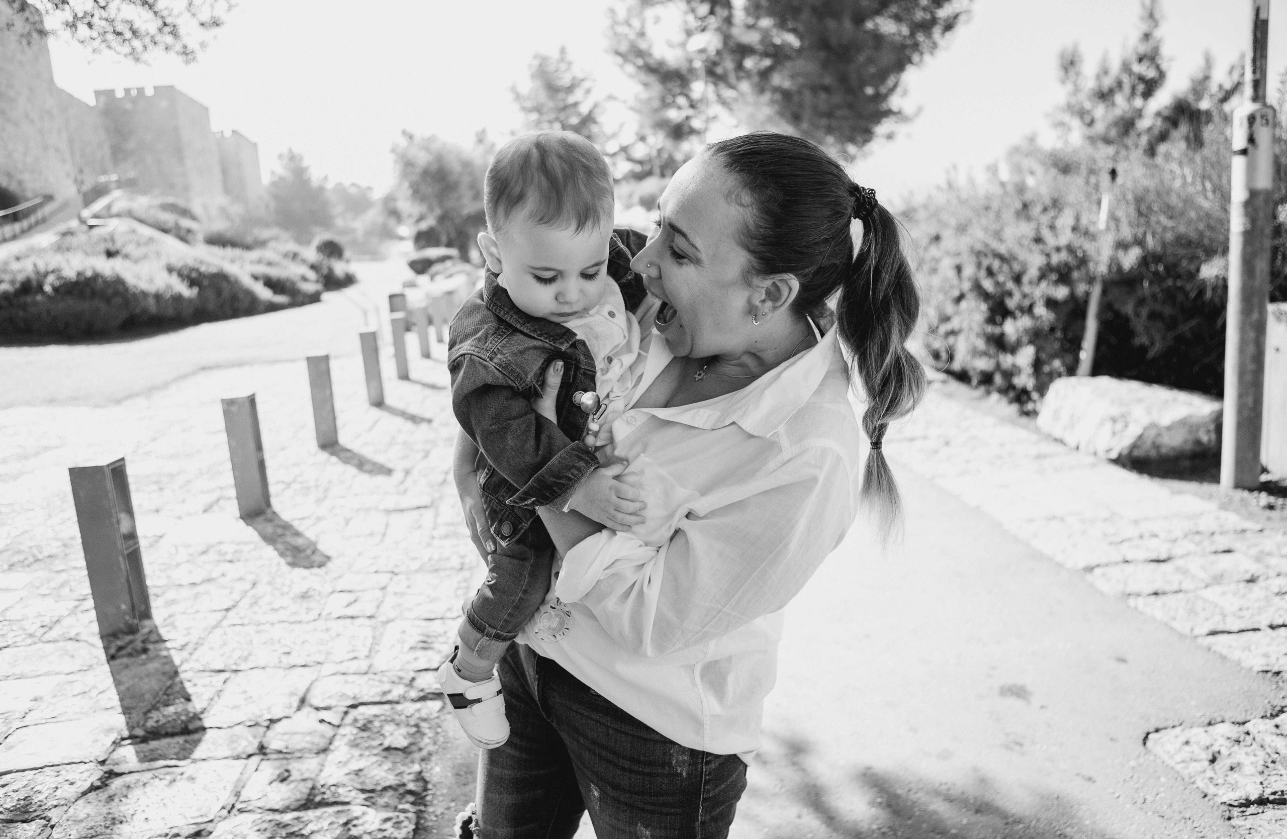 AT THE WALLS OF THE OLD CITY. PHOTOGRAPHER IN ISRAEL