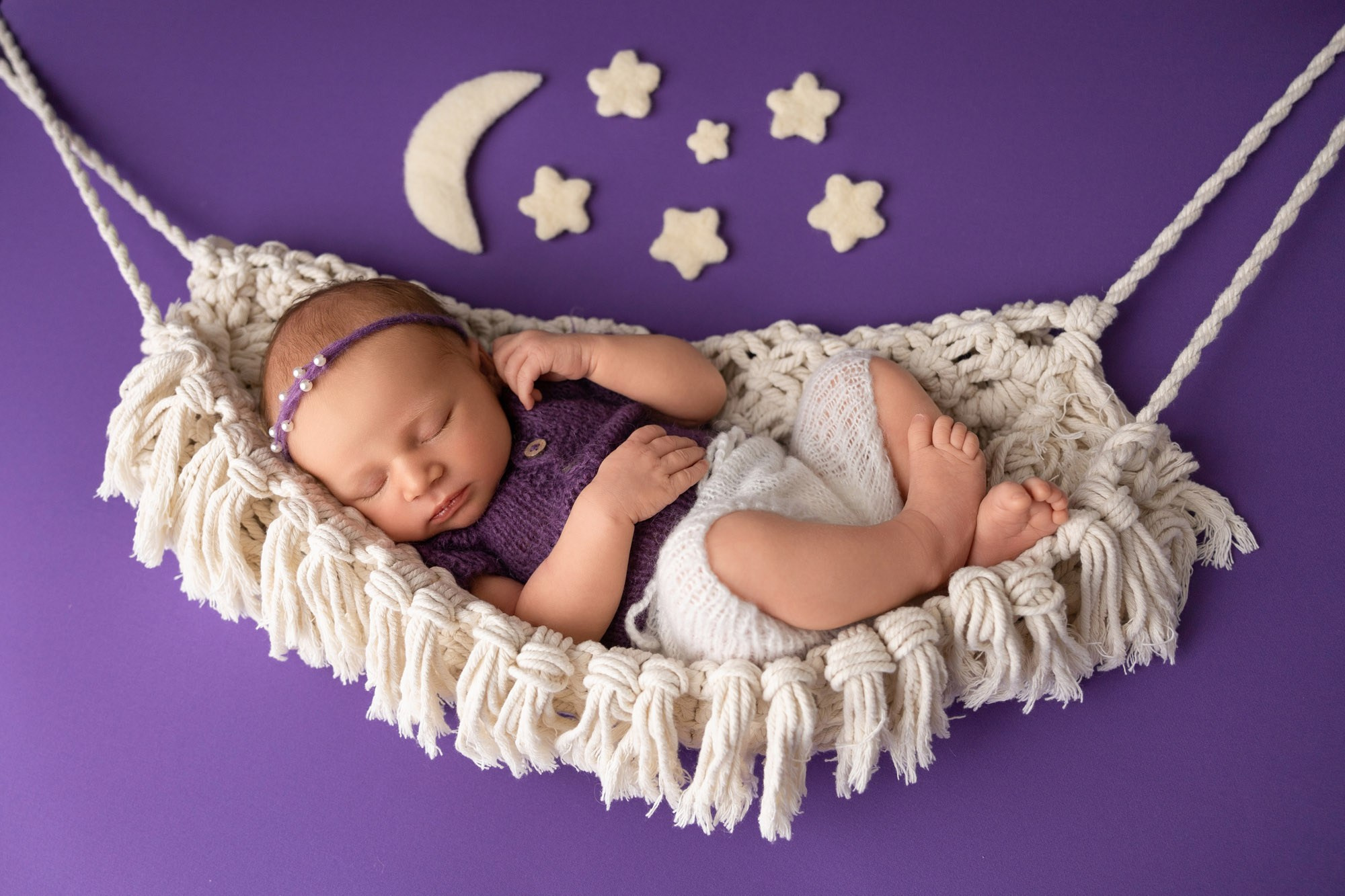 newborn sleeping in hummock under the stars