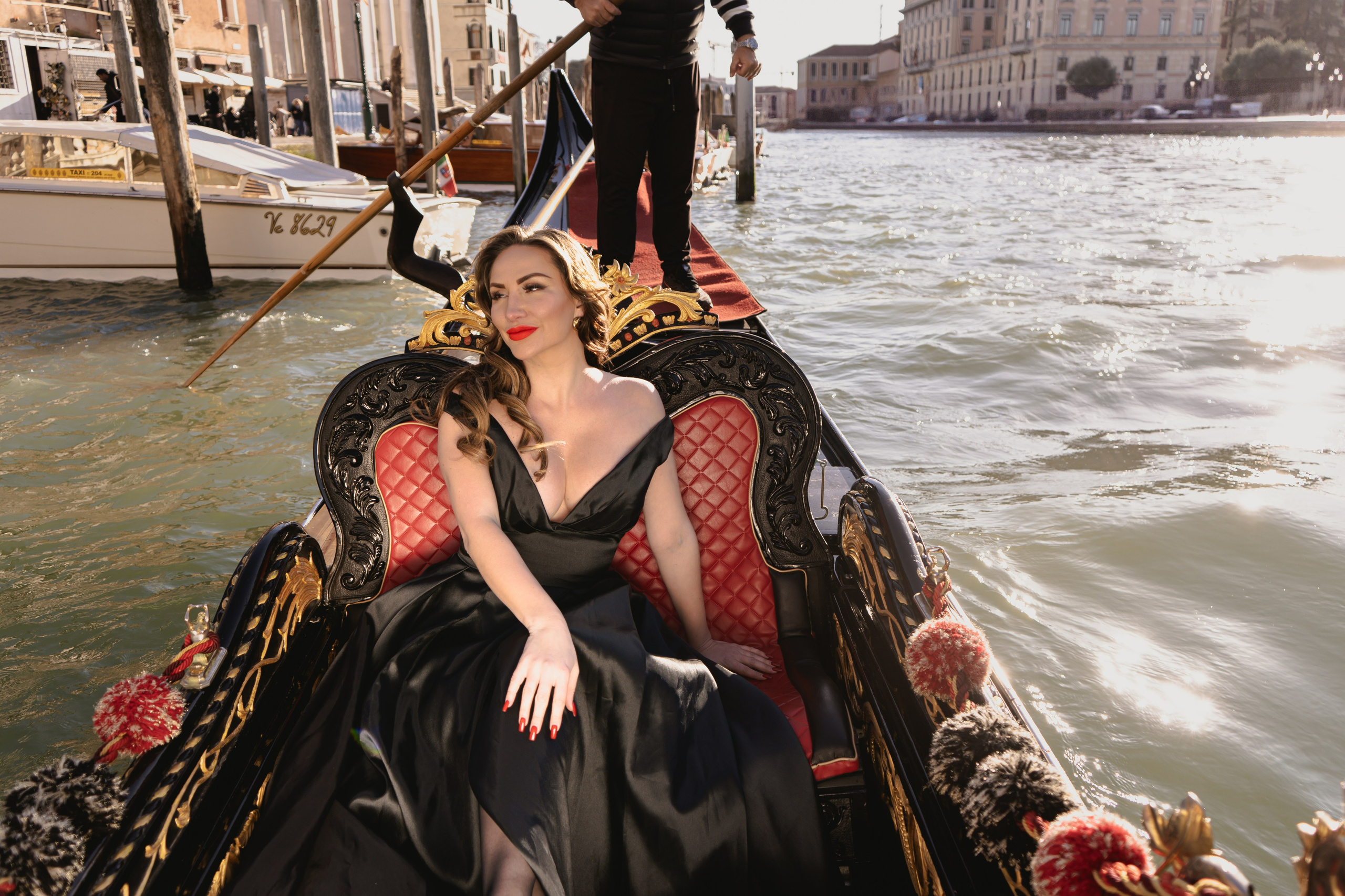 Fashion shoot in Venice with elegant Italian styling and gondolas in the background.
