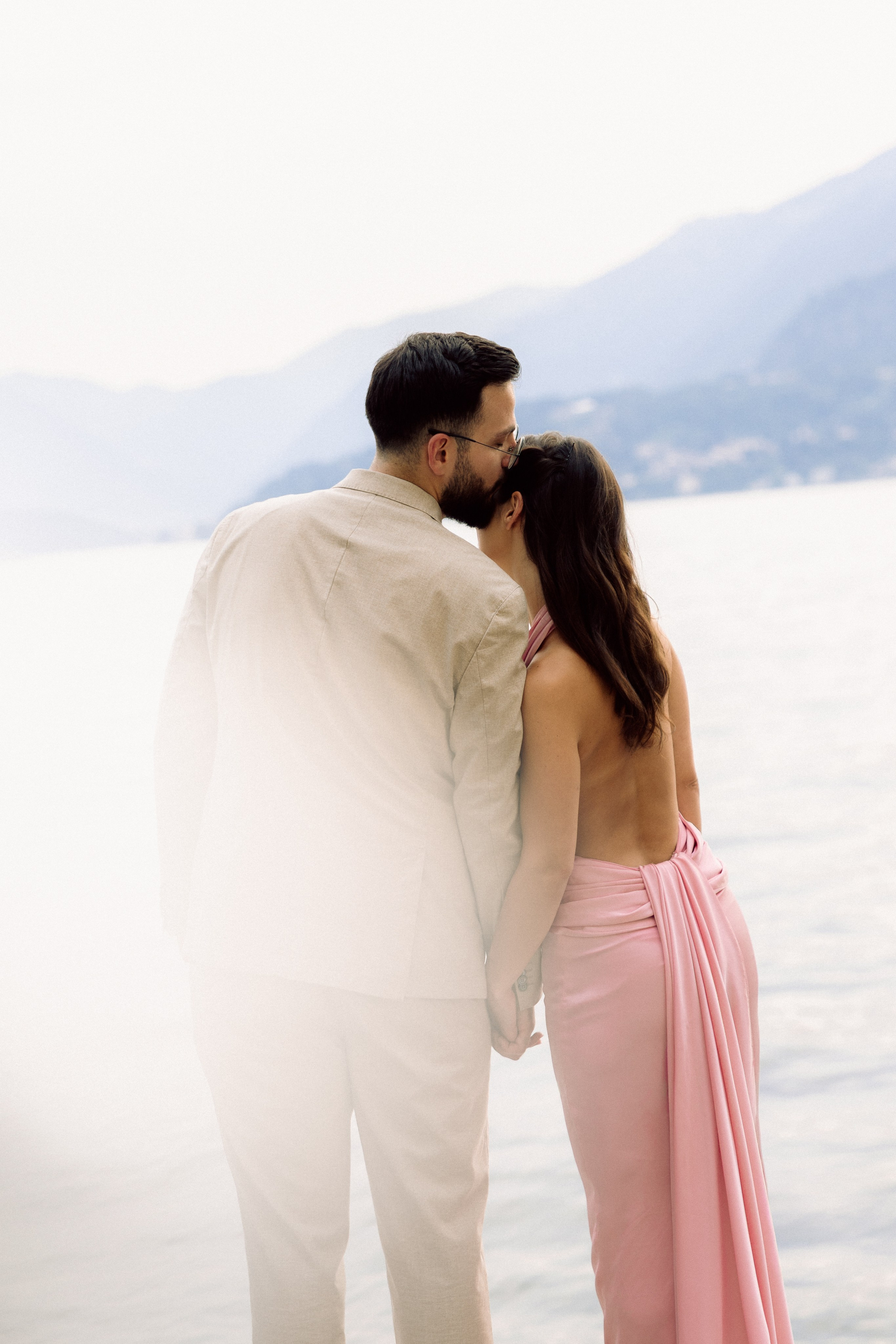 Romantic couple portrait overlooking Lake Como after a surprise proposal