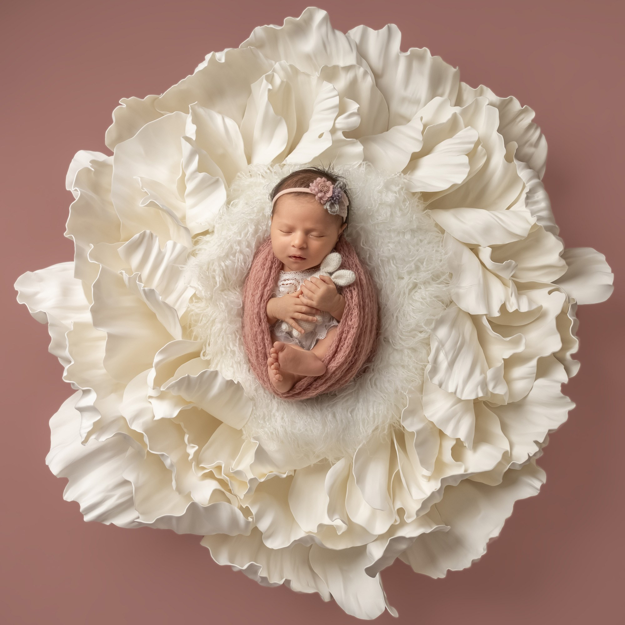 newborn baby in the big flower