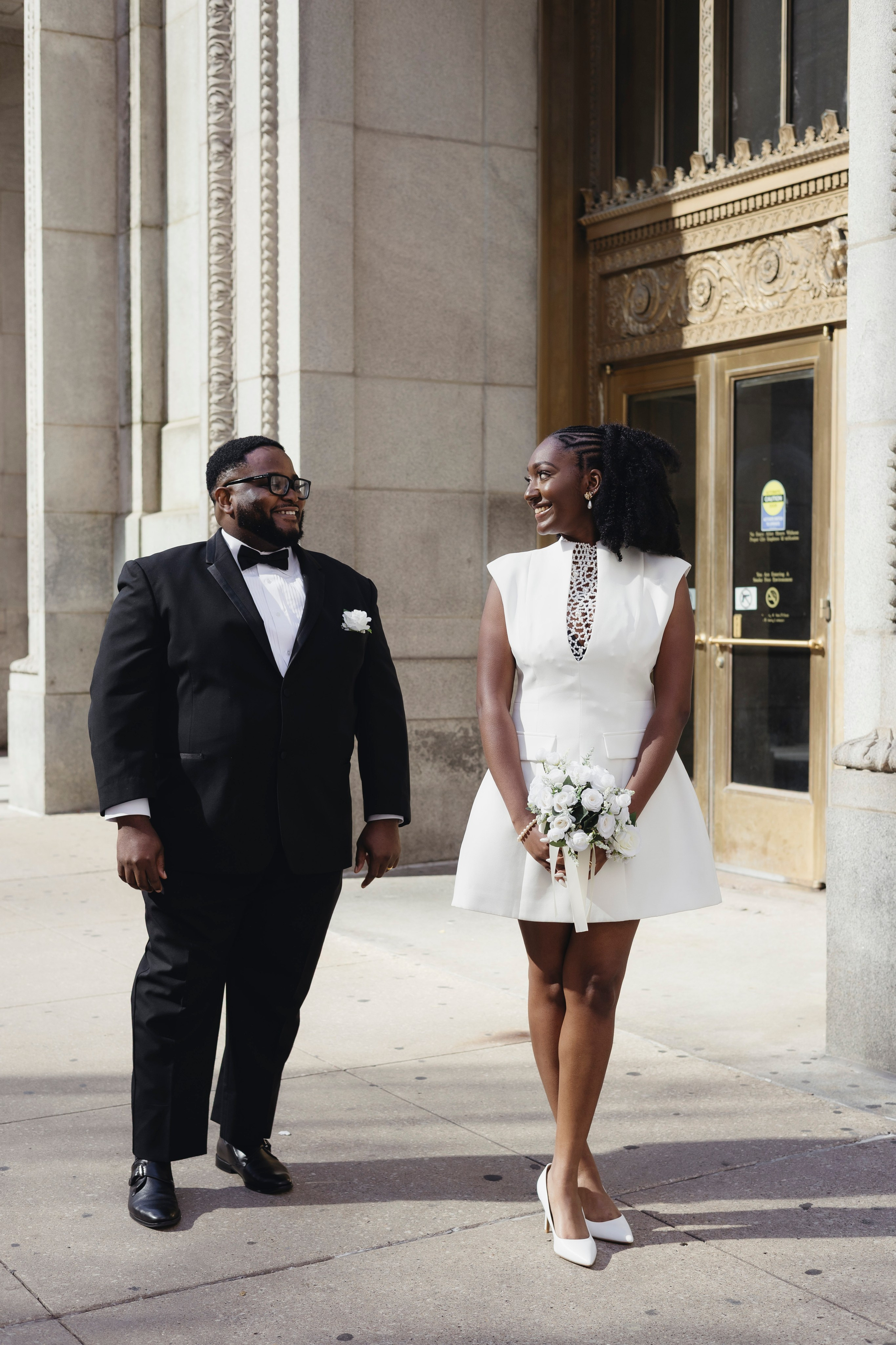 Chicago City Hall wedding with couple embracing on courthouse steps