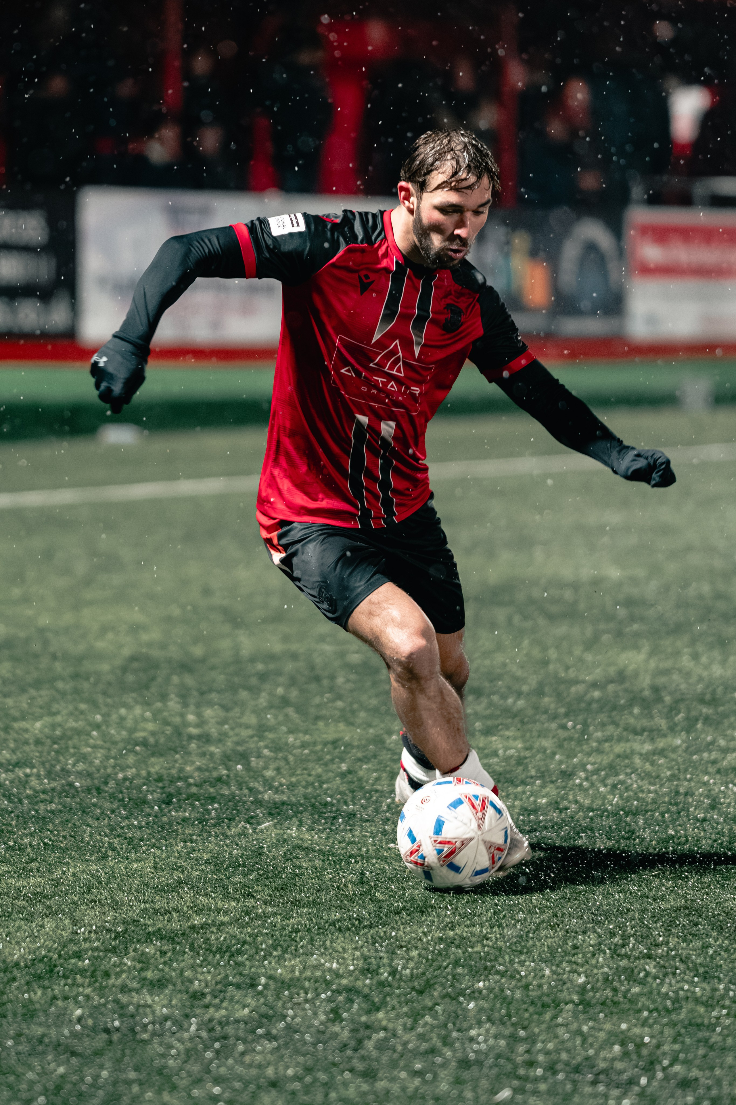 Tyler Roberts controls the ball under floodlights during Birmingham Senior Cup match vs Tamworth at The Lamb Ground, Feb 3 2026.