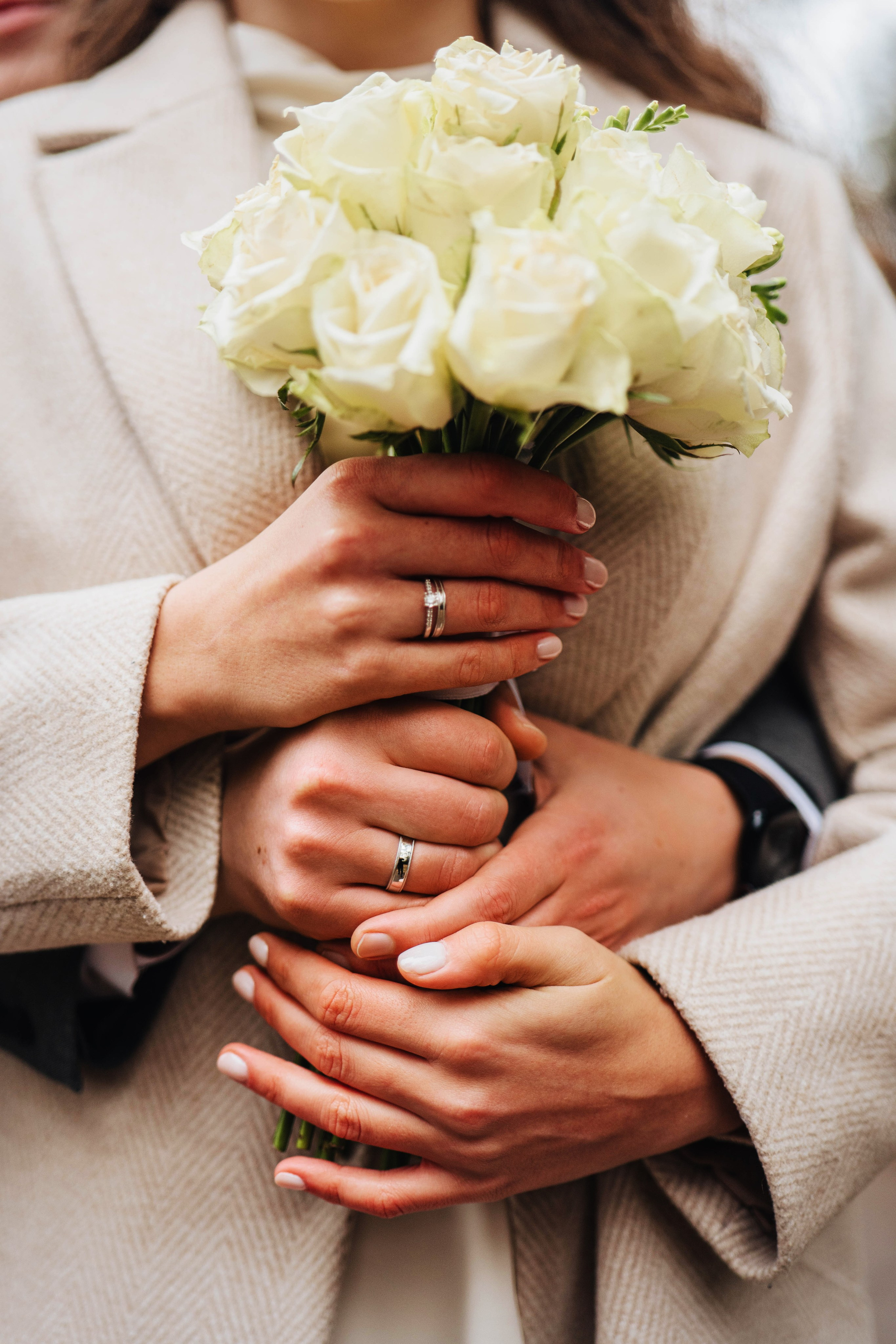 stylish closeup photo of hands with flowers 