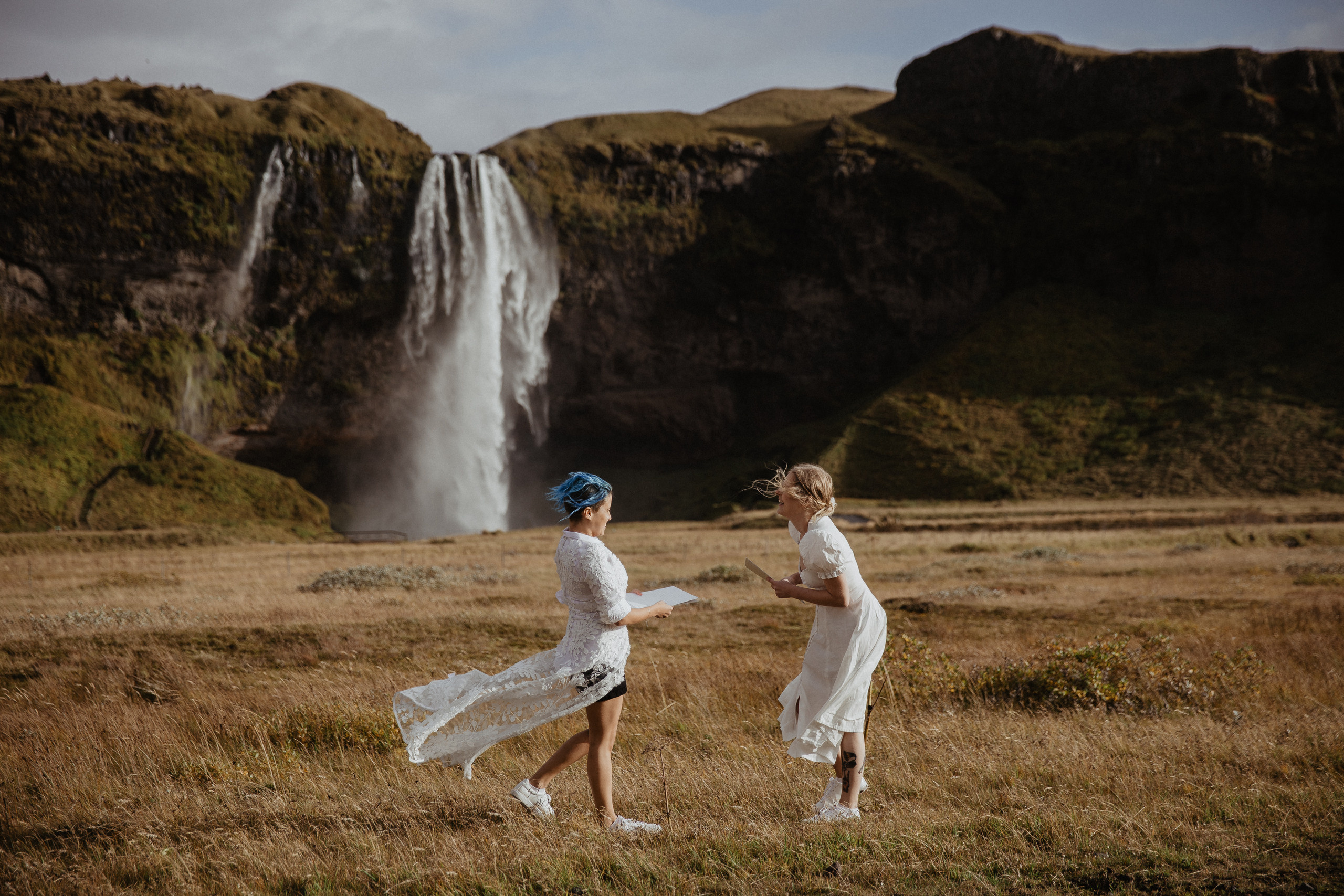 ceremony at Seljalandsfoss, lgbt elopement in Iceland