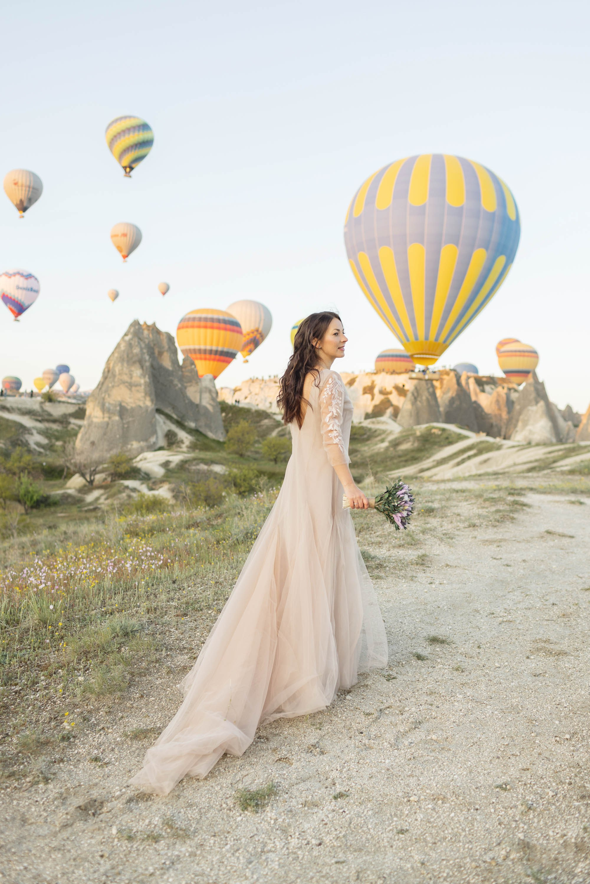 Magical Wedding Photoshoot in Cappadocia: Balloons, Caves, and Valleys. Julia Ganch I Fashion Wedding Photography I Cappadocia Turkey