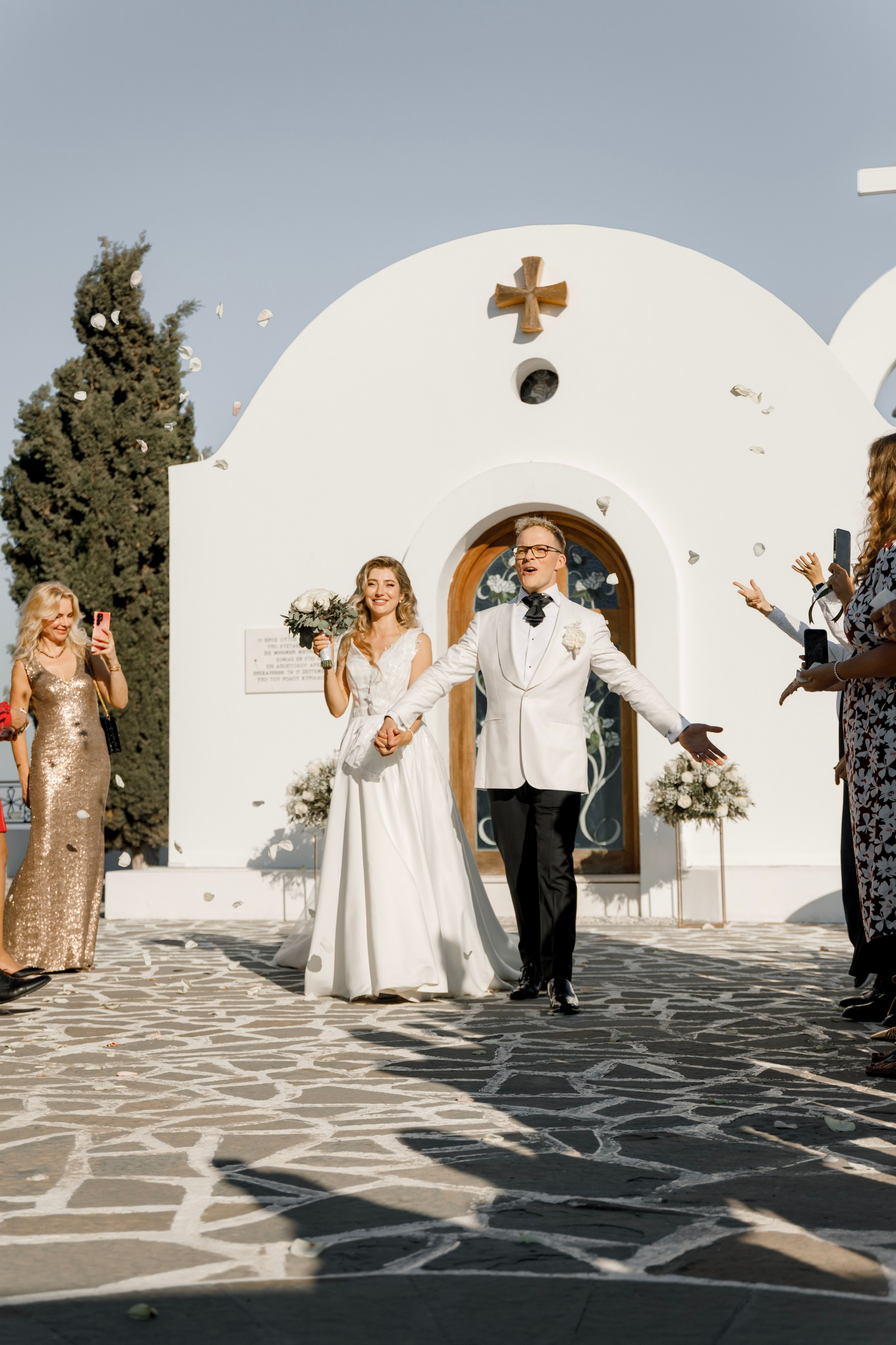 Groom and bride are happy after the ceremony in Church Agia Sofia in luxury hotel Esperos Village. Rhodes Greece