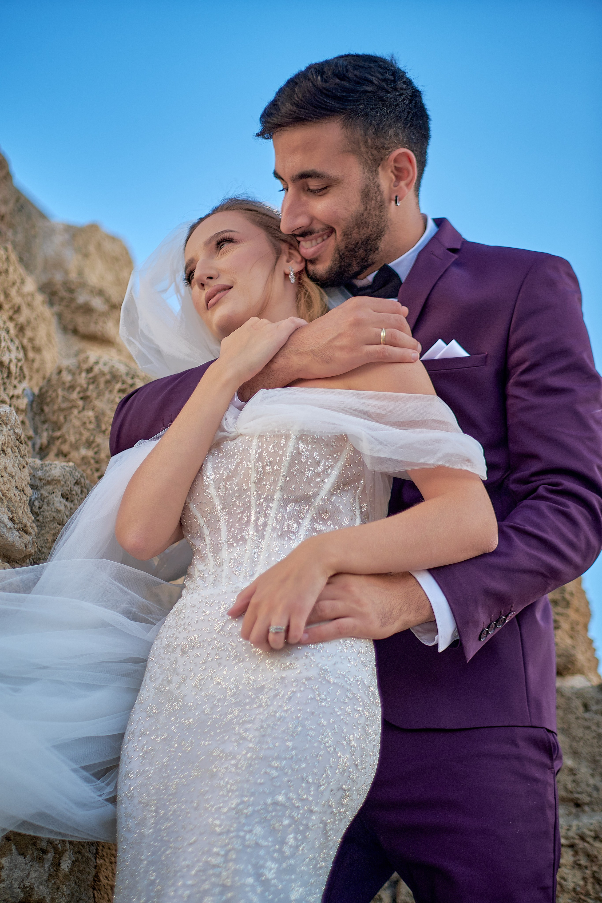 Romantic wedding couple portrait, bride with veil and groom in suit, emotional wedding photography by Maxim Polak Israel