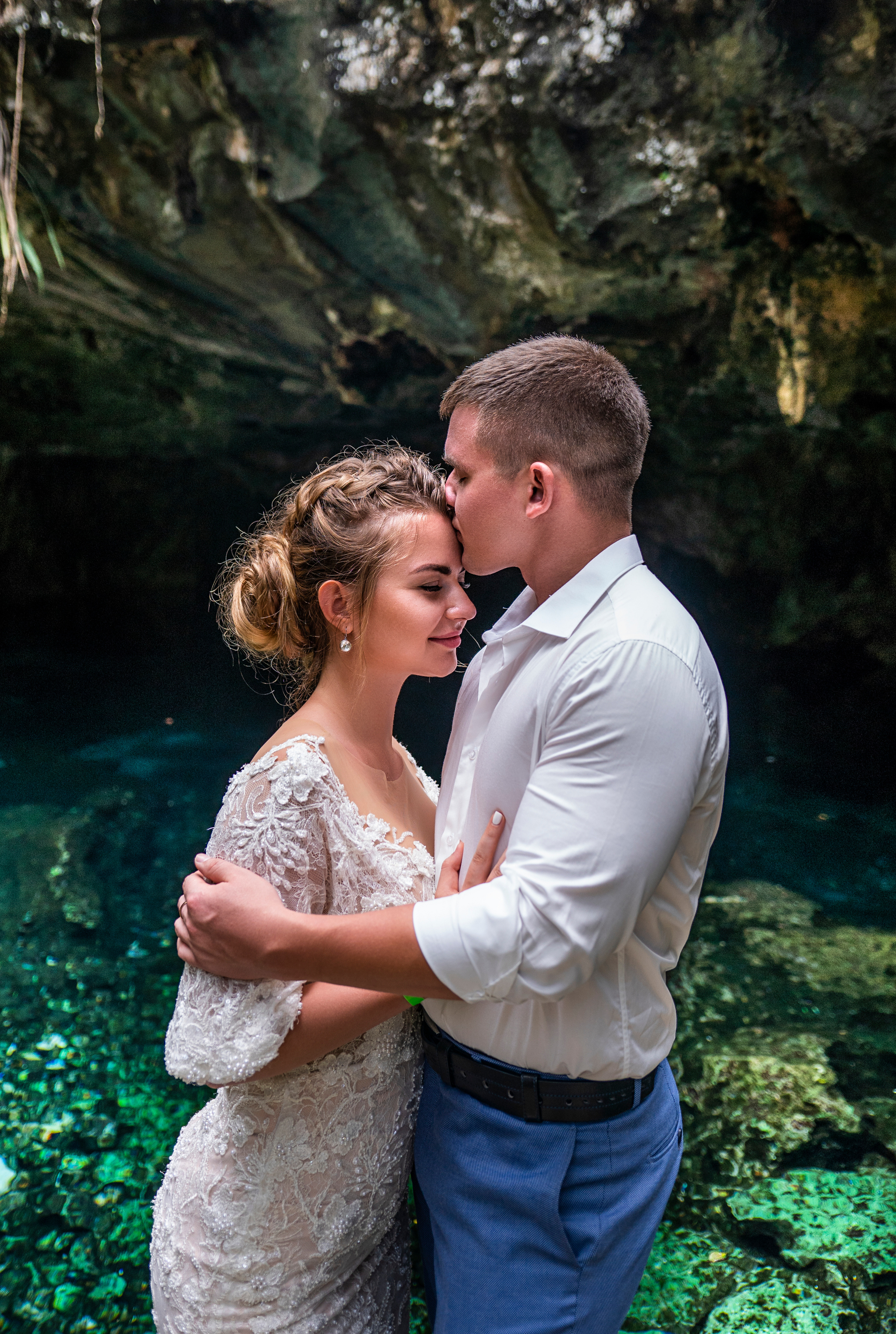 Couple getting engaged in exotic cenote location