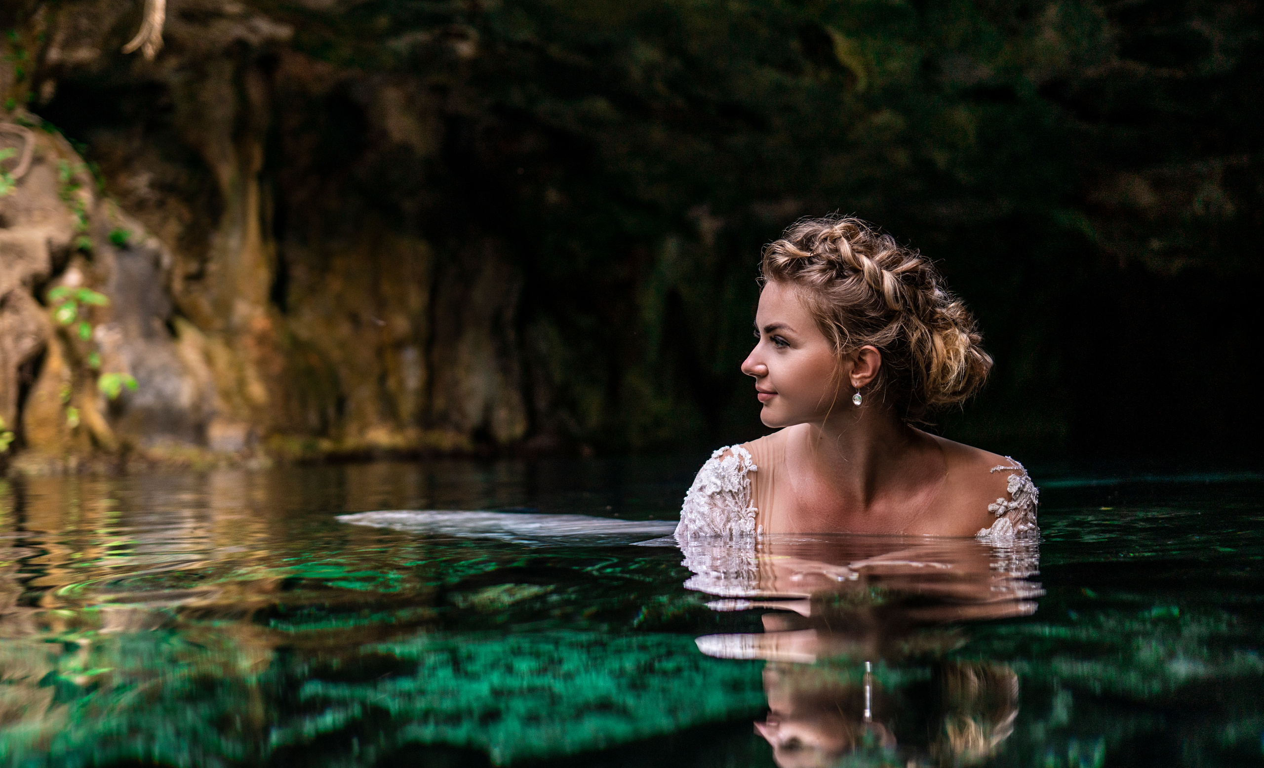 Natural light bridal portrait in sacred Mayan water