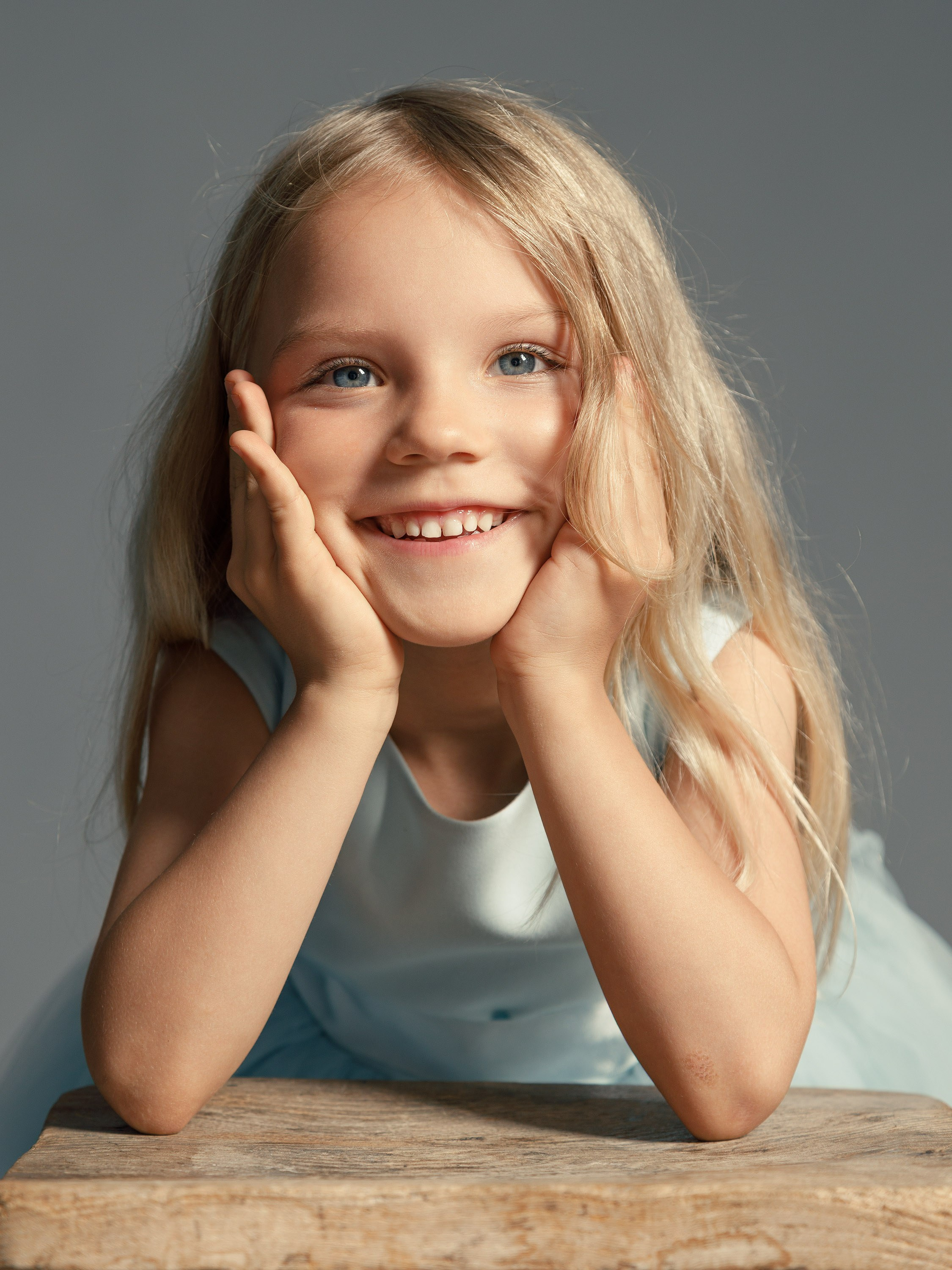 girl smiling, close-up portrait, studio