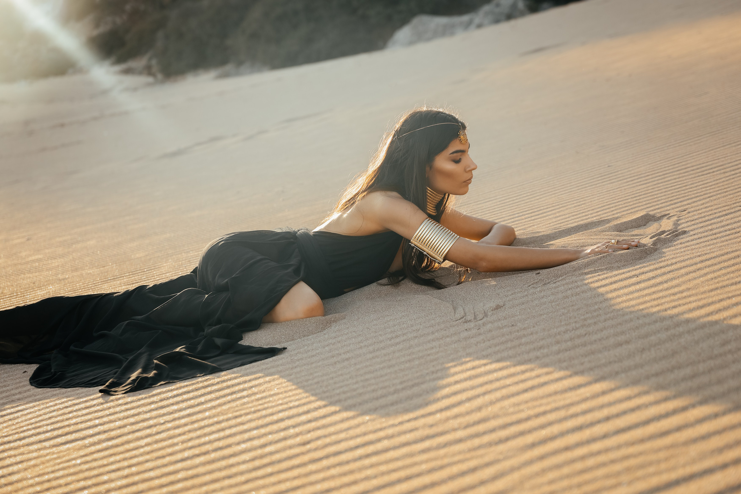 A chic girl in a black dress in the Desert. Rhodes island, Greece