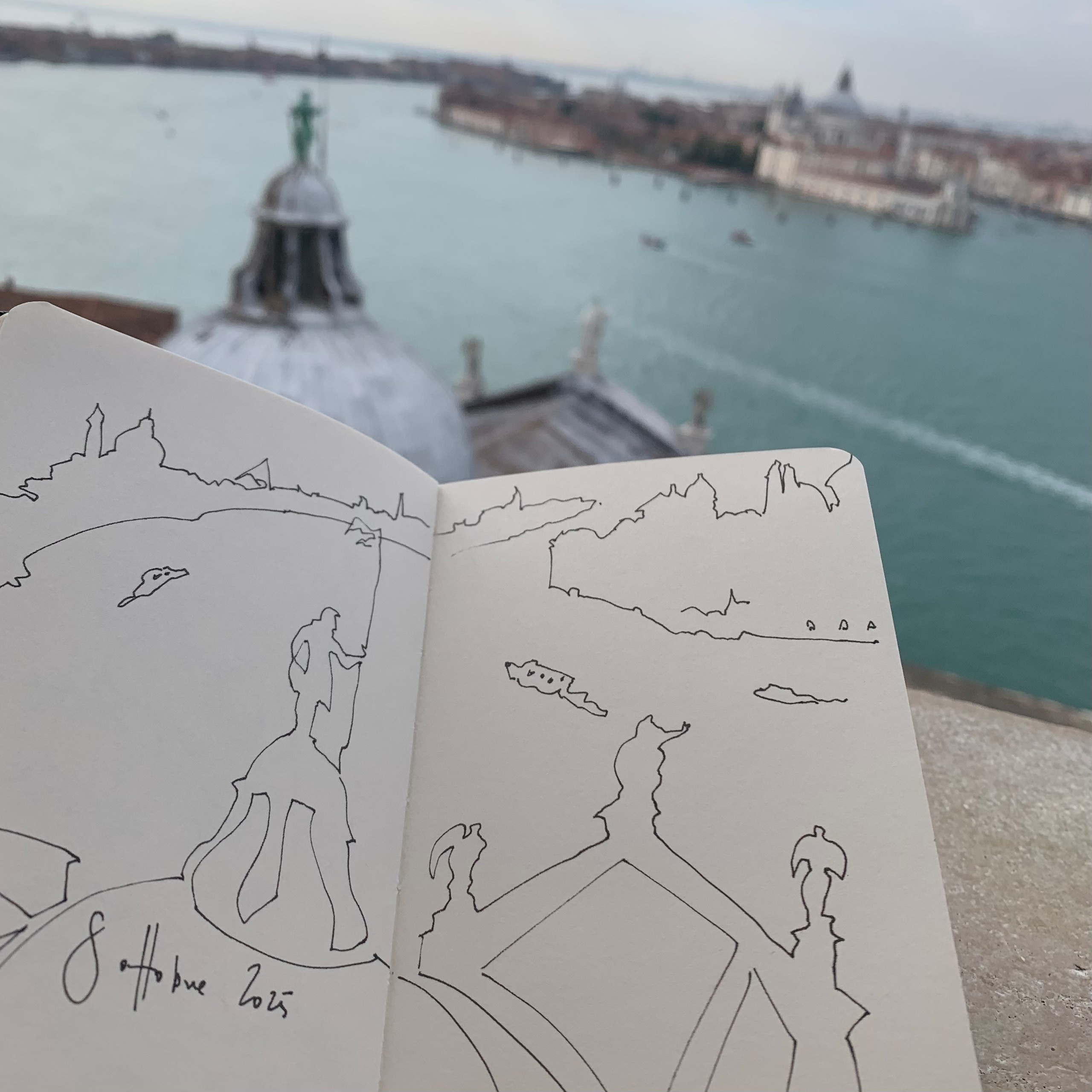 Moleskine notebook with original drawings made in Venice, research on paper for an editorial project by an artist who lives and works in Venice. A breathtaking view of Venice from a tower.
