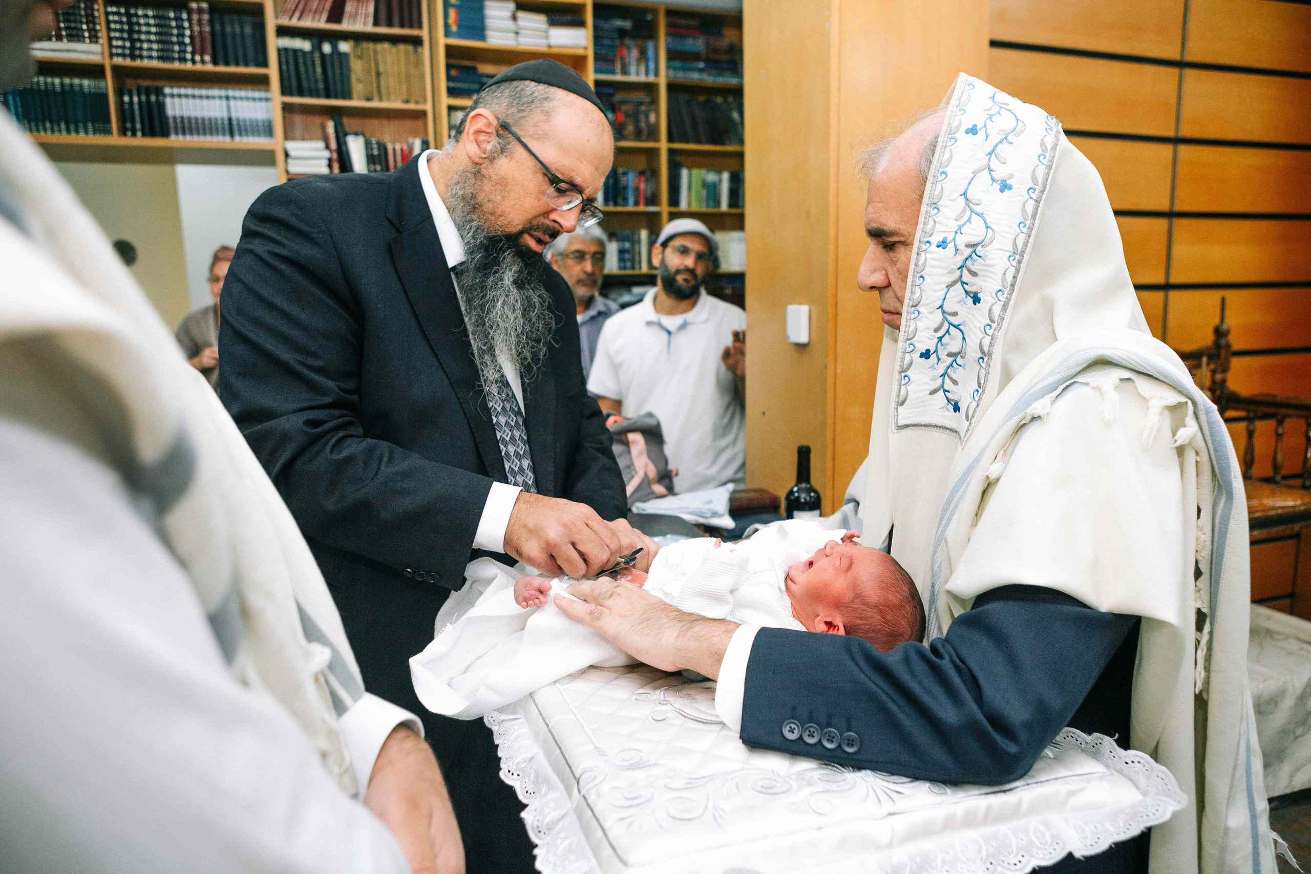 BRITH MILA IN THE SMALL SYNAGOGUE. PHOTOGRAPHER IN ISRAEL