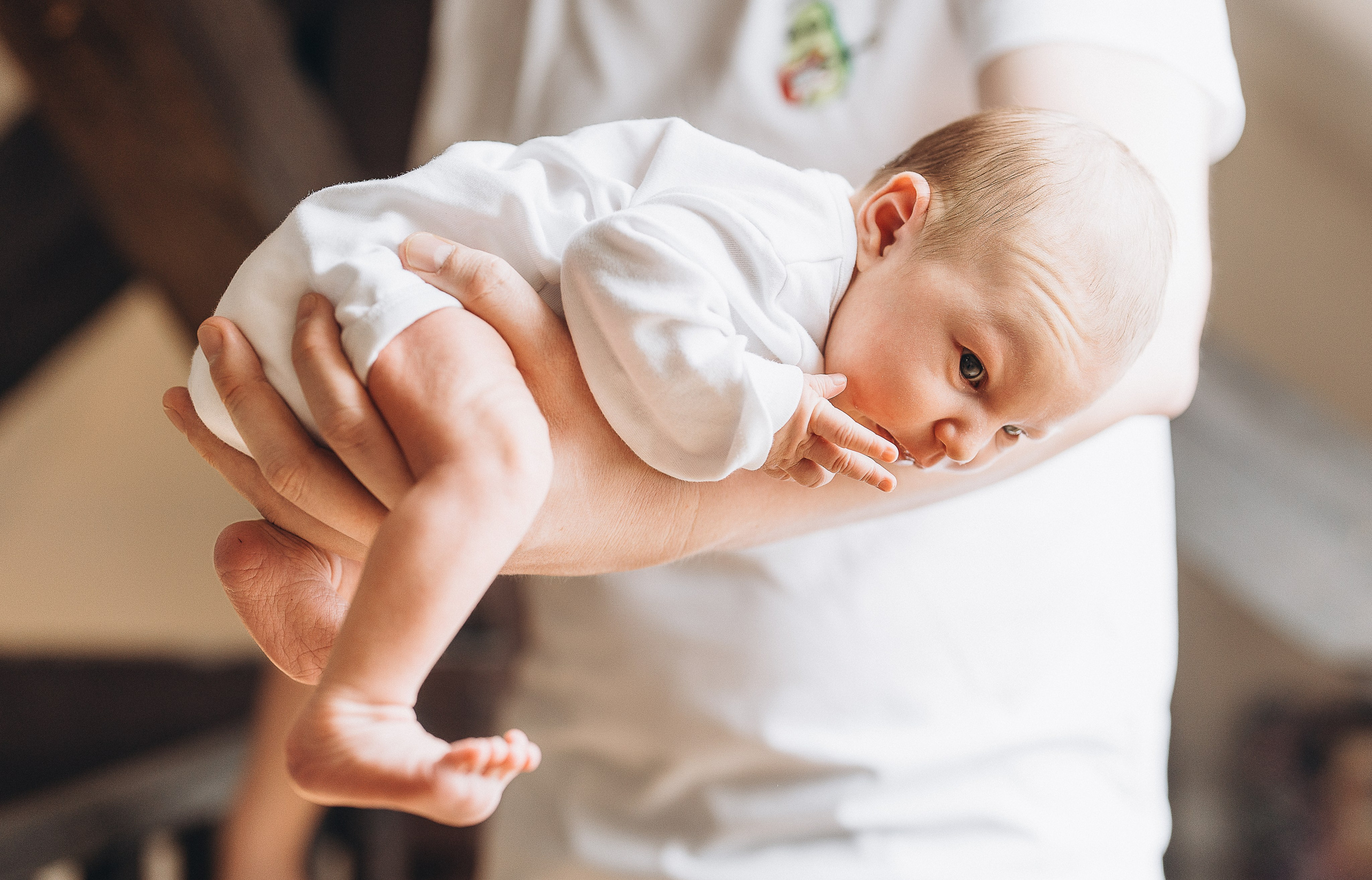 Baby girl home shooting. Family, conceptual women portrait photograher in Geneva, Switzerland