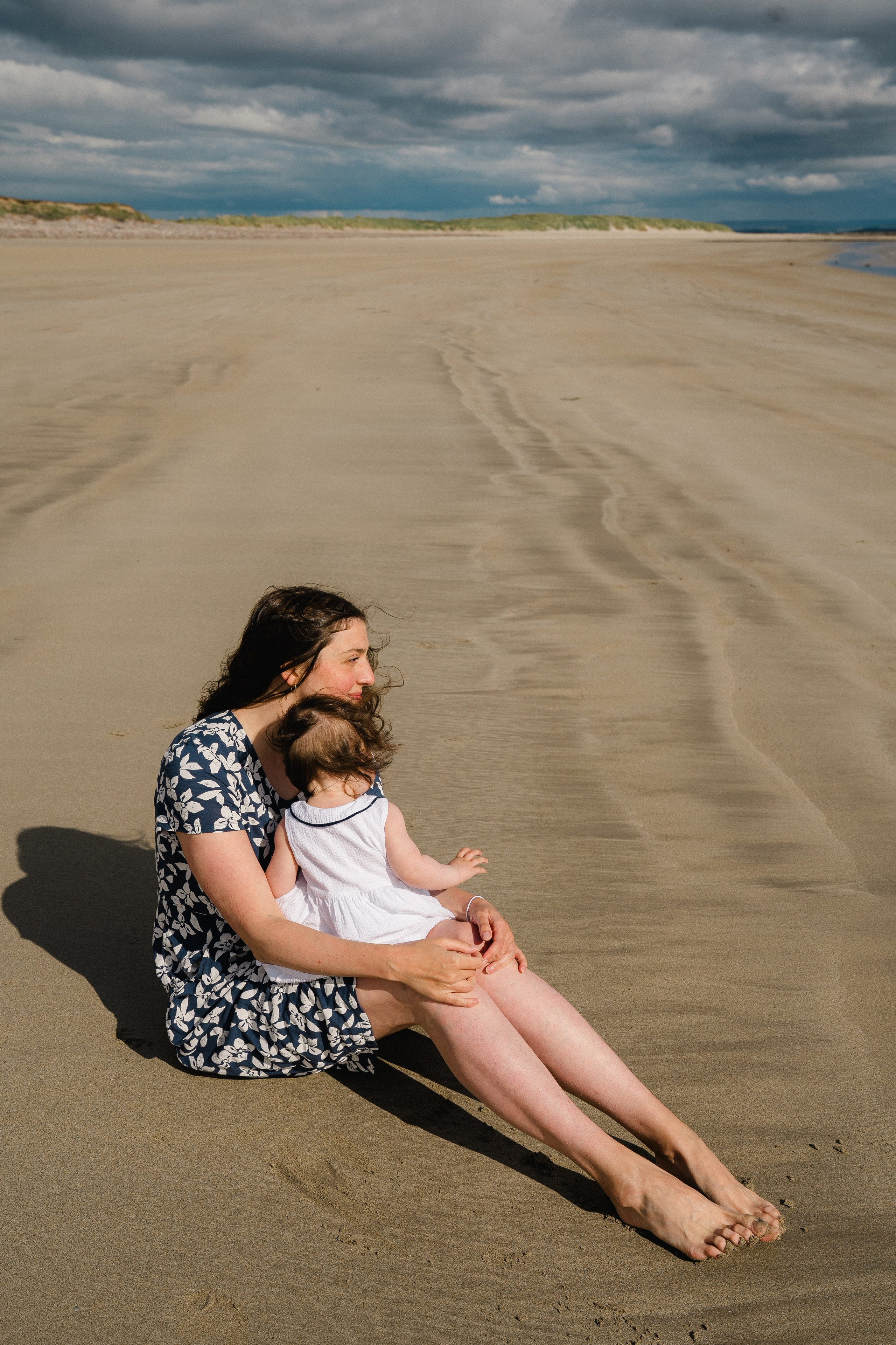 Darya and Mia at the ocean. Wedding and family photographer Ireland