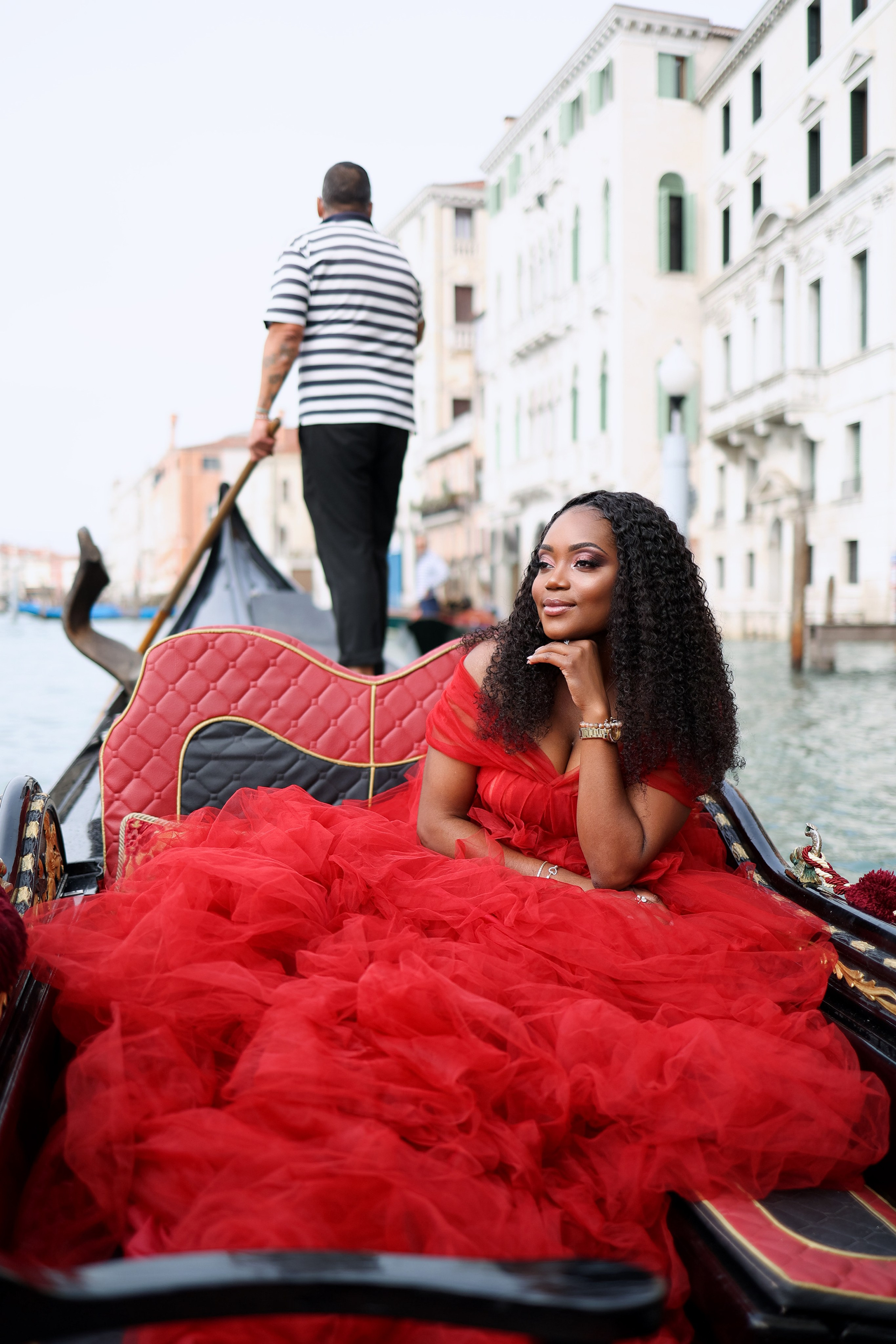 dark-skinned girl on a gondola ride in Venice 
