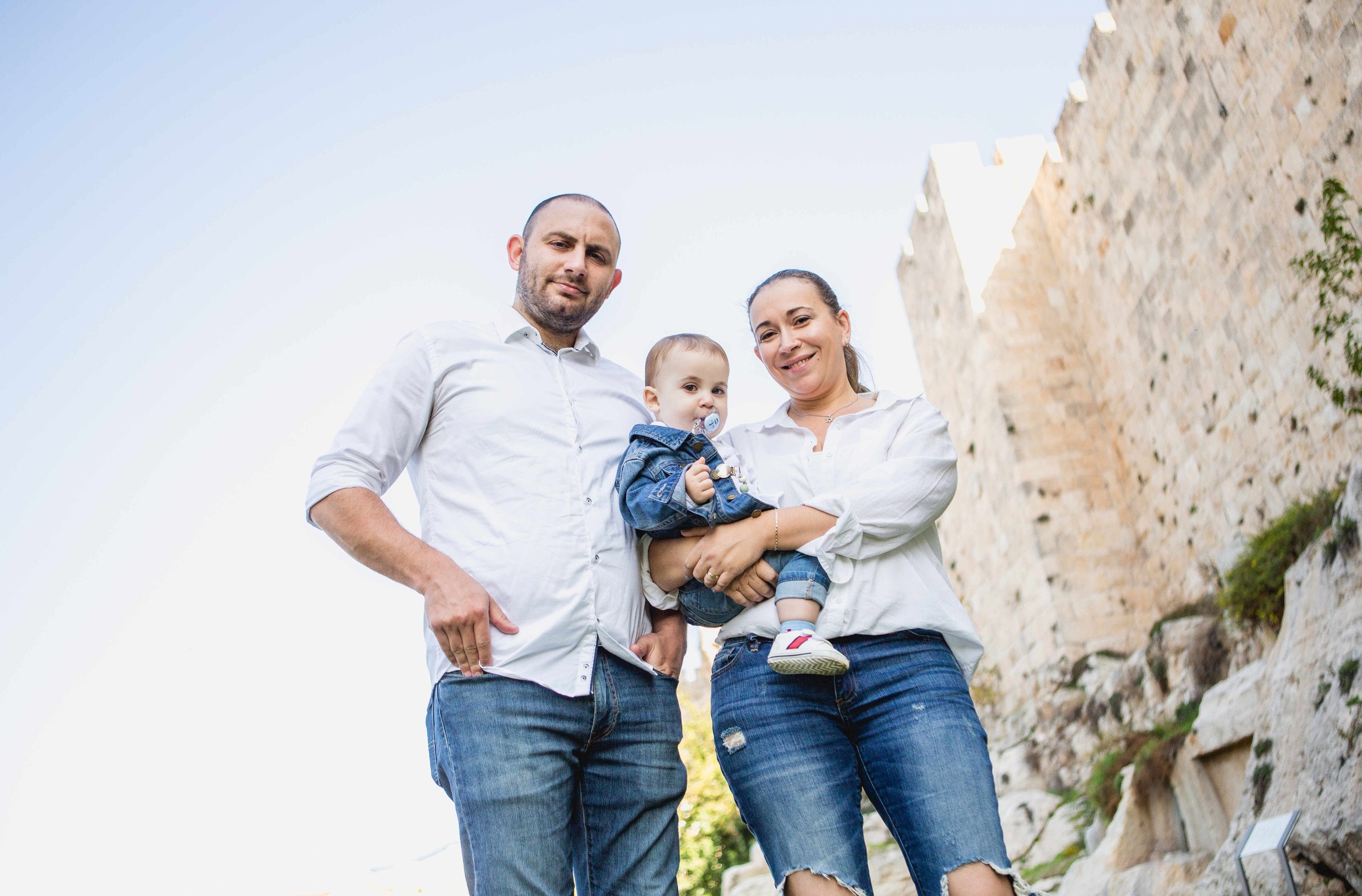 AT THE WALLS OF THE OLD CITY. PHOTOGRAPHER IN ISRAEL