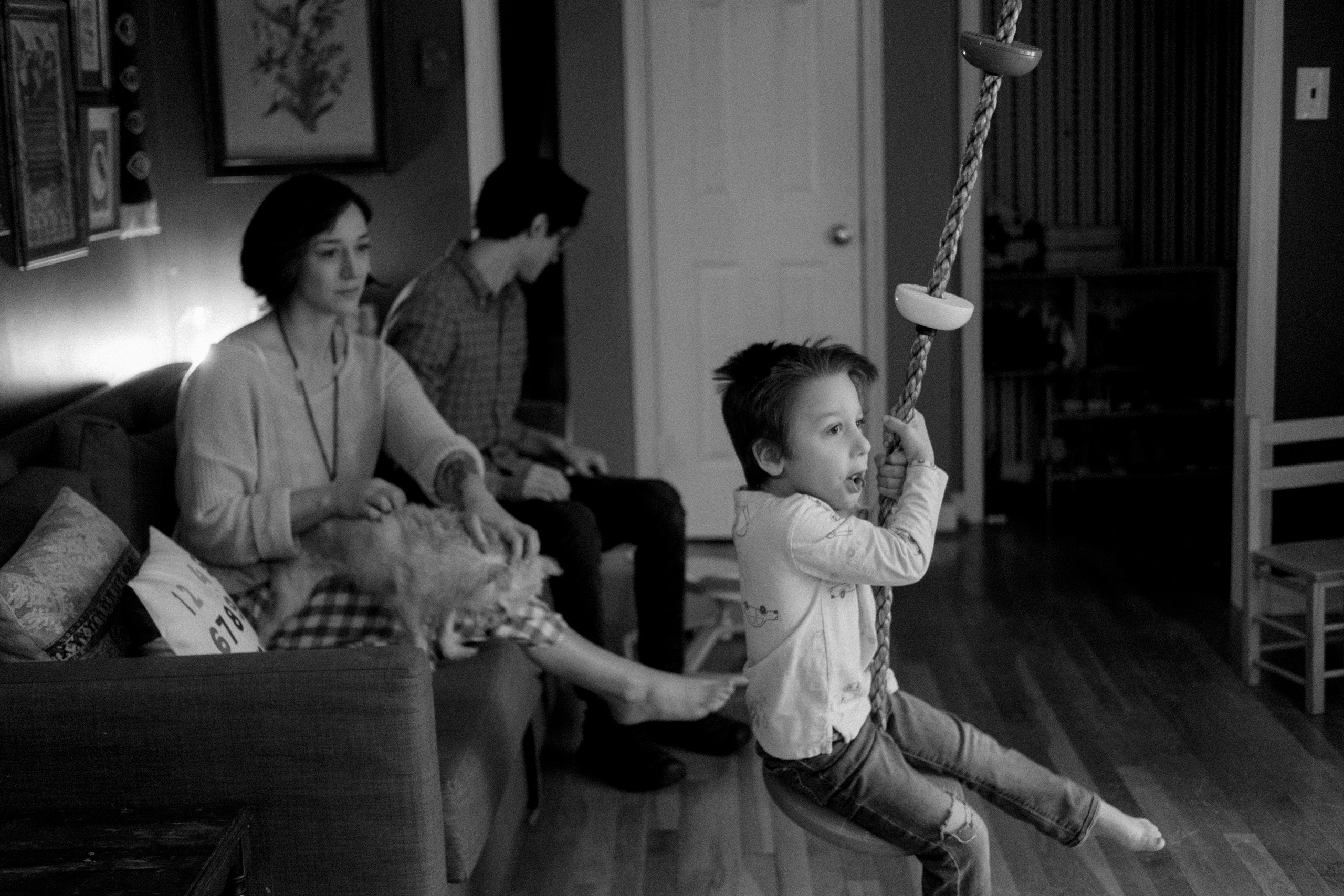 Natural light family portrait of parents and their autistic twin boys