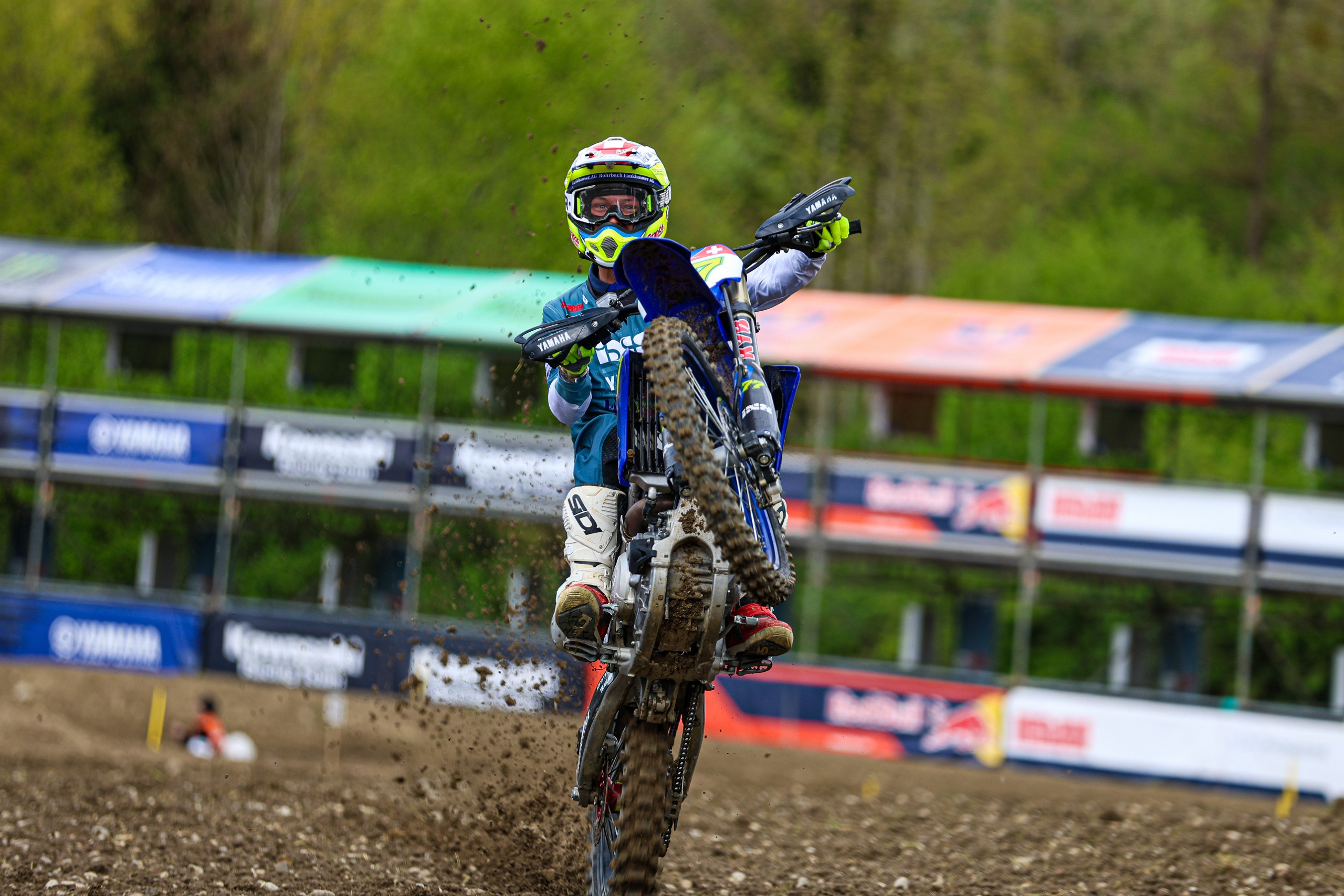 Dominique Aegerter WorldSBK rider performing a wheelie at MXGP of Switzerland 2025 with his Yamaha bike, Motocross World Championship