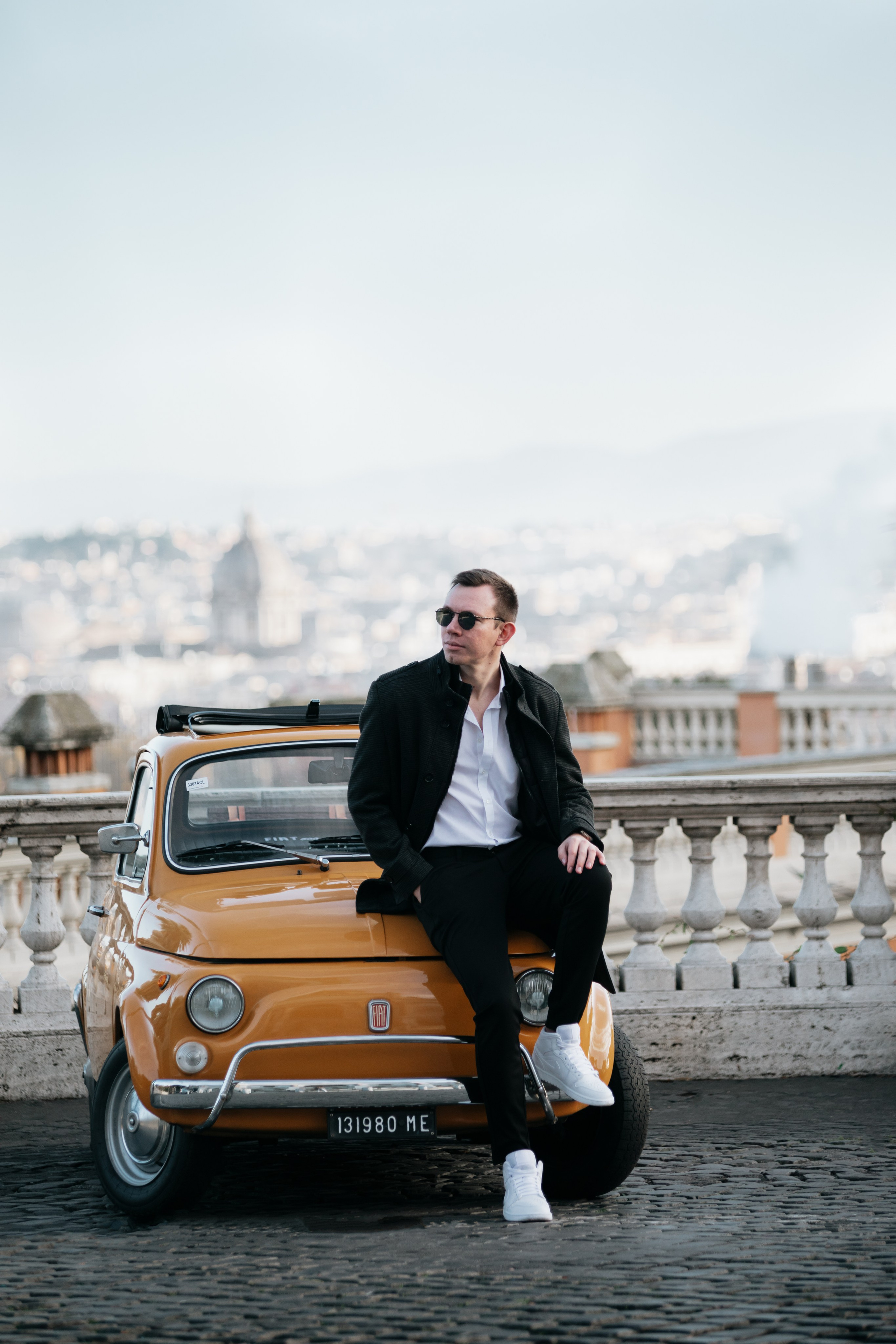 Fiat 500 and Vespa. Photographer in Rome