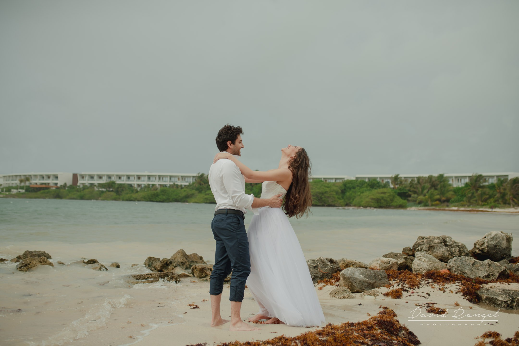 Secilia and Brandon tras the dress at the Conrad Tulum Hotel. Destination wedding photographer based in Cancun and Riviera Maya with service worldwide