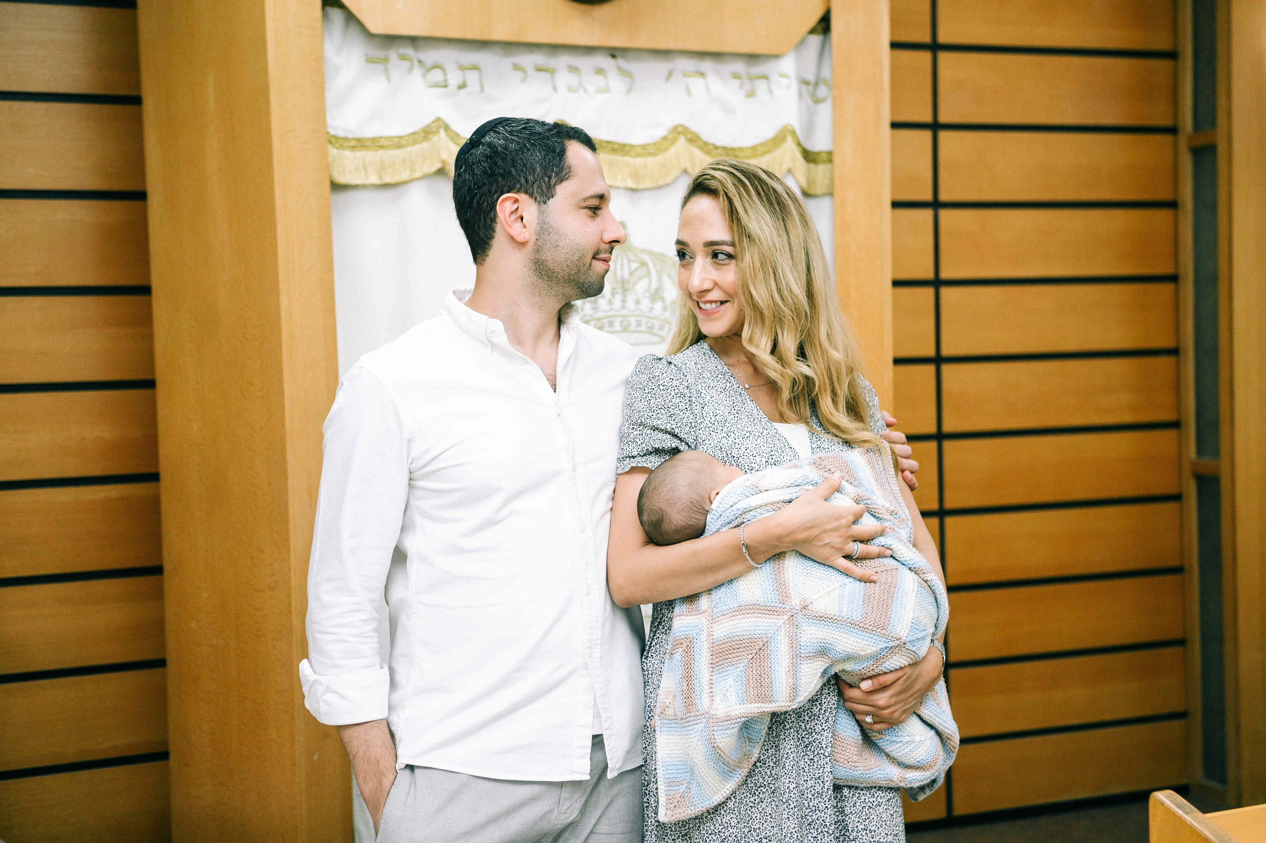 BRITH MILA IN THE SMALL SYNAGOGUE. PHOTOGRAPHER IN ISRAEL