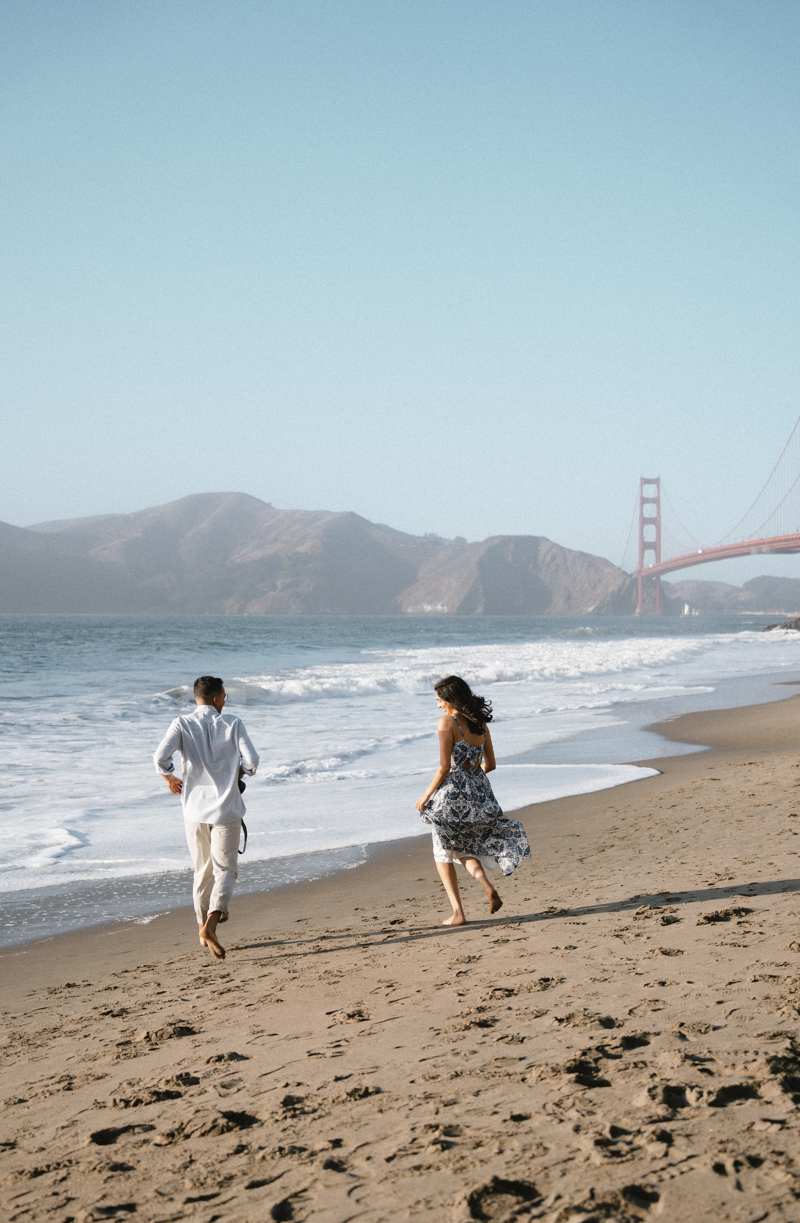Engagement and Couple’s Photoshoot at Marshall’s Beach with iconic Golden Gate bridge view. Soulo Photography | San Francisco Bay Area Based Photographer