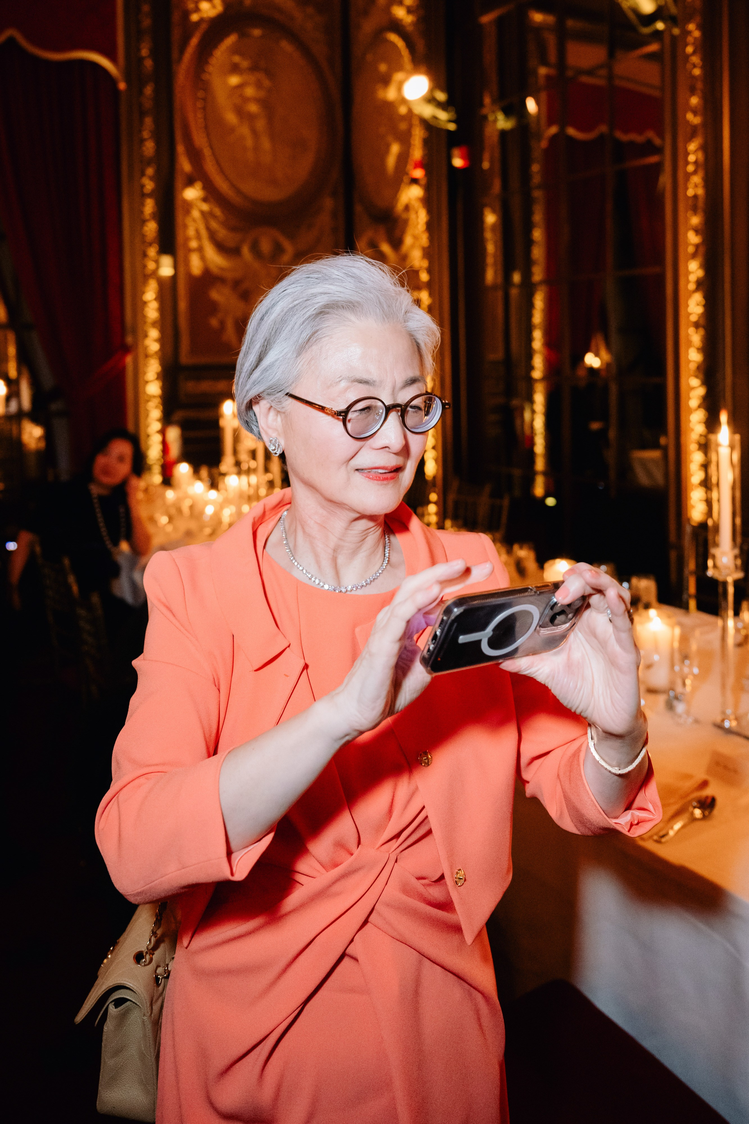 a woman in a pink suit