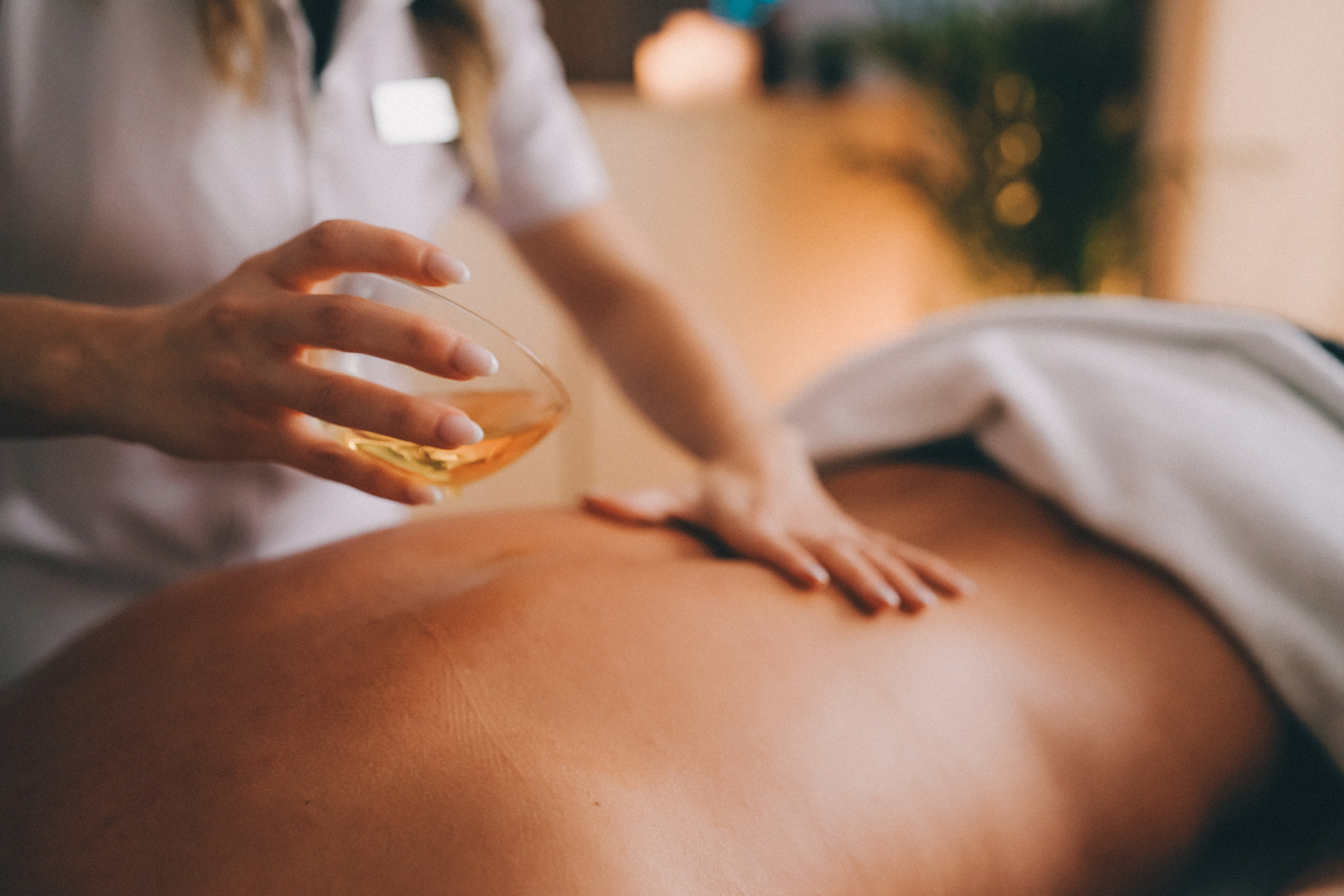 Brand photography detail of a wellbeing treatment in a calm, spa environment