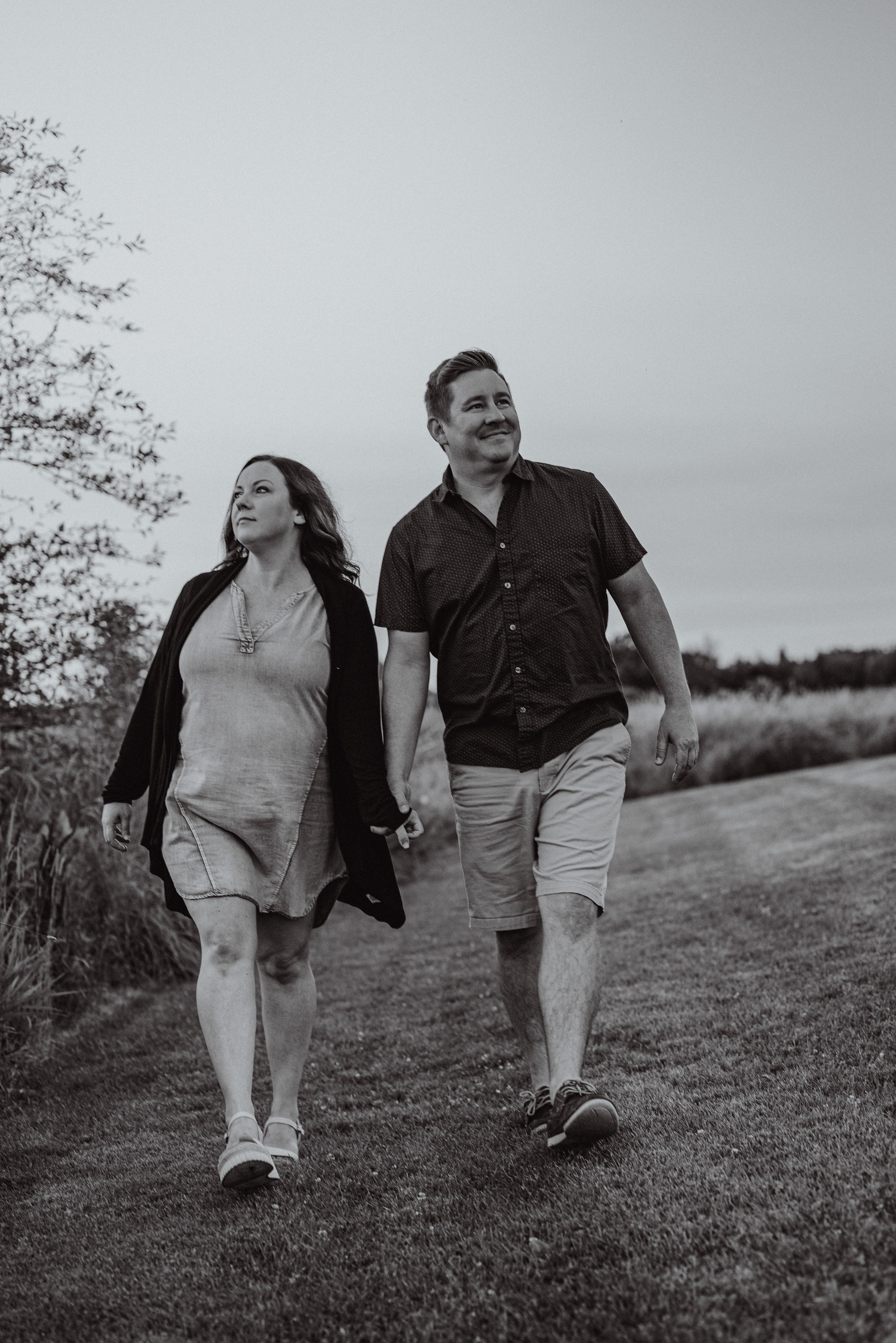 Tender embrace at sunset in Green Bay, showcasing the couple’s love and connection through natural light photography.