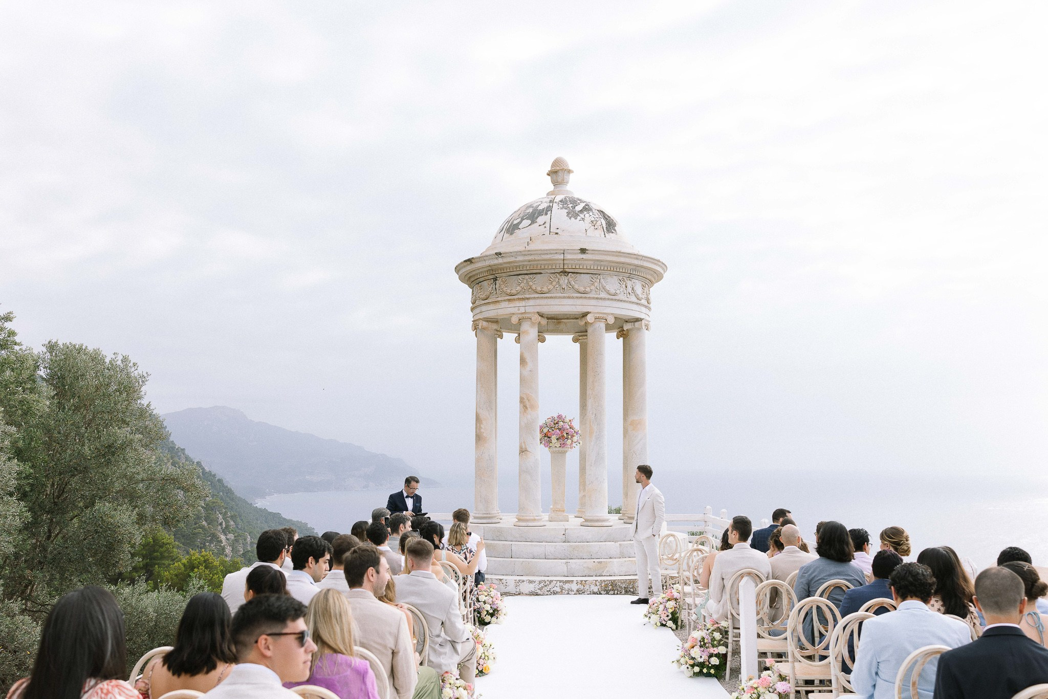 Groom standing alone at Son Marroig before ceremony begins