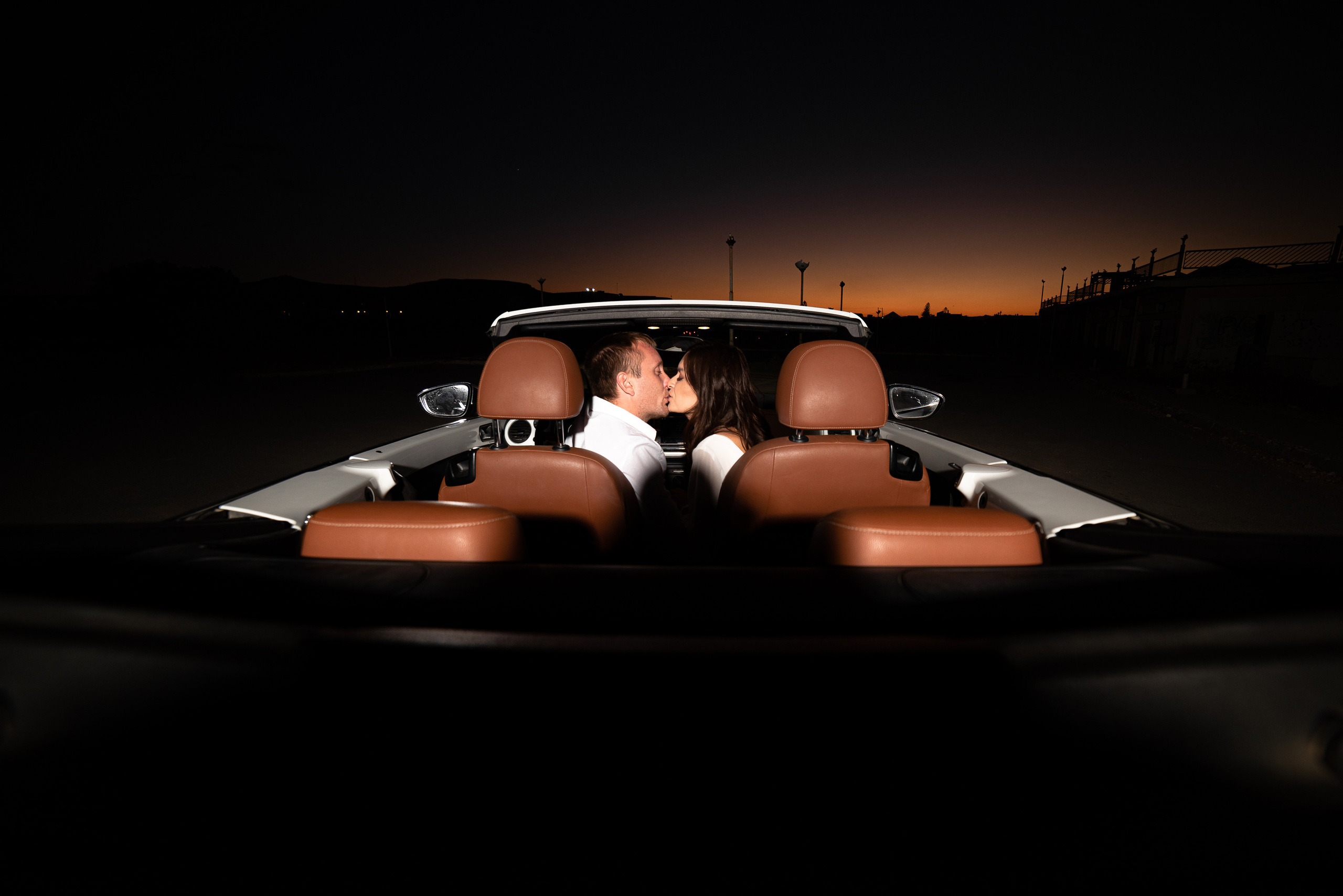 Wedding in Crete couple in a convertible kissing