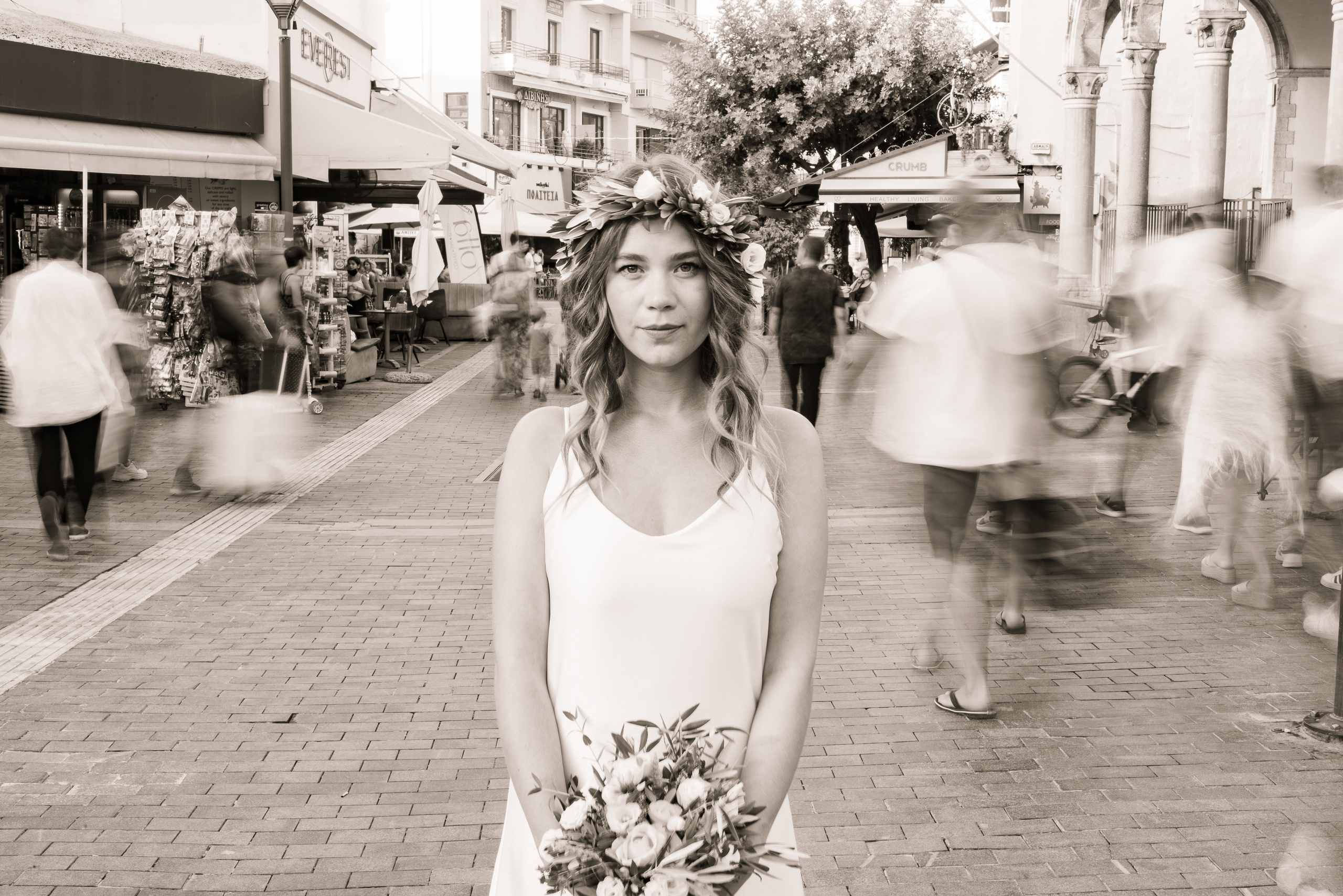 Wedding photographer in Heraklion the bride is standing time has slowed down