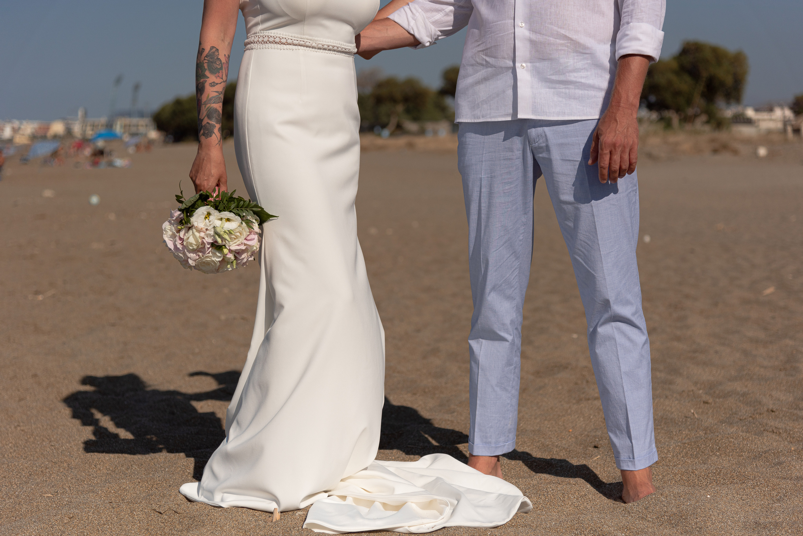 Wedding photo shoot in Heraklion on the beach couple walking