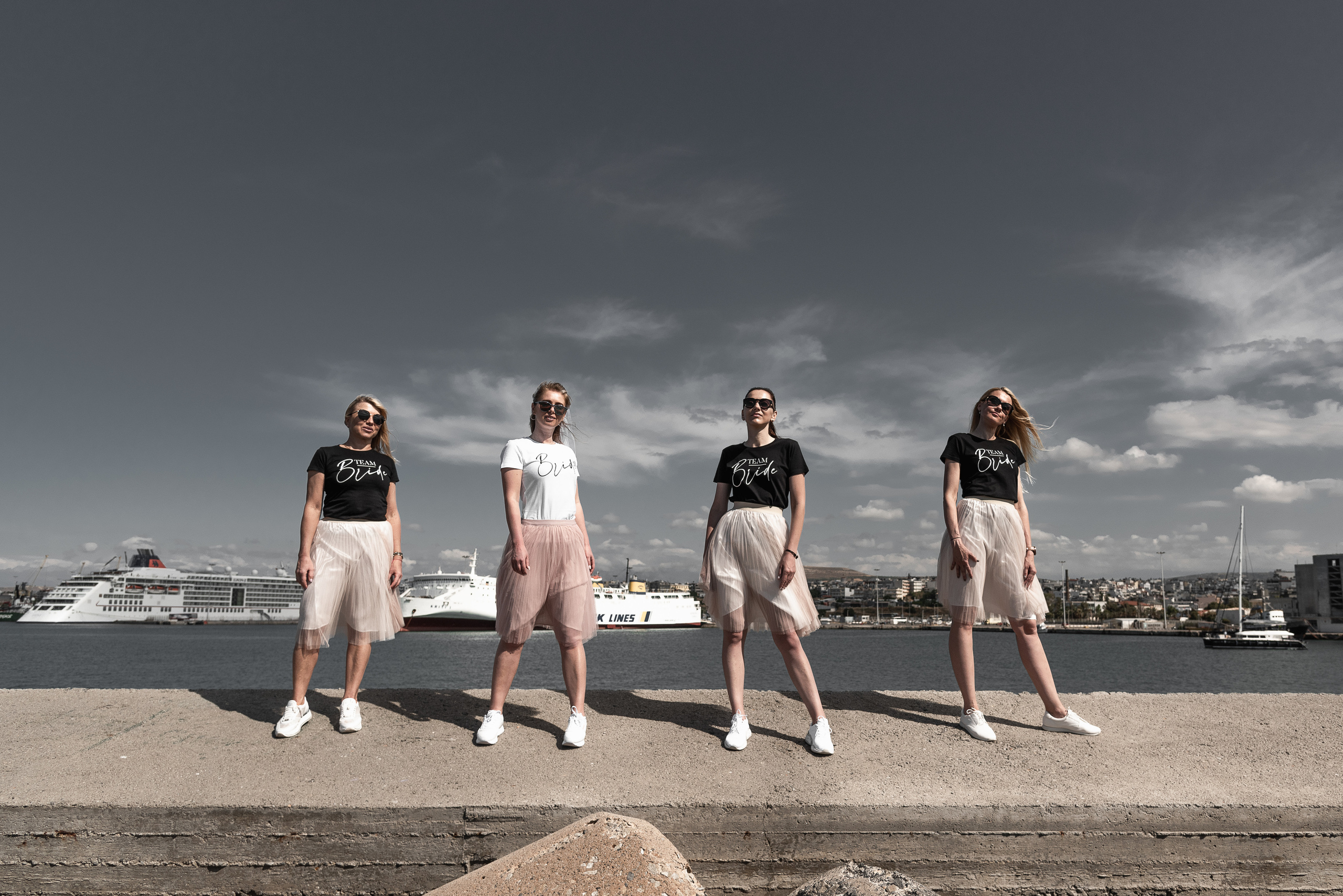 Wedding photo shoot in Crete in the old town bachelorette party in pink skirts