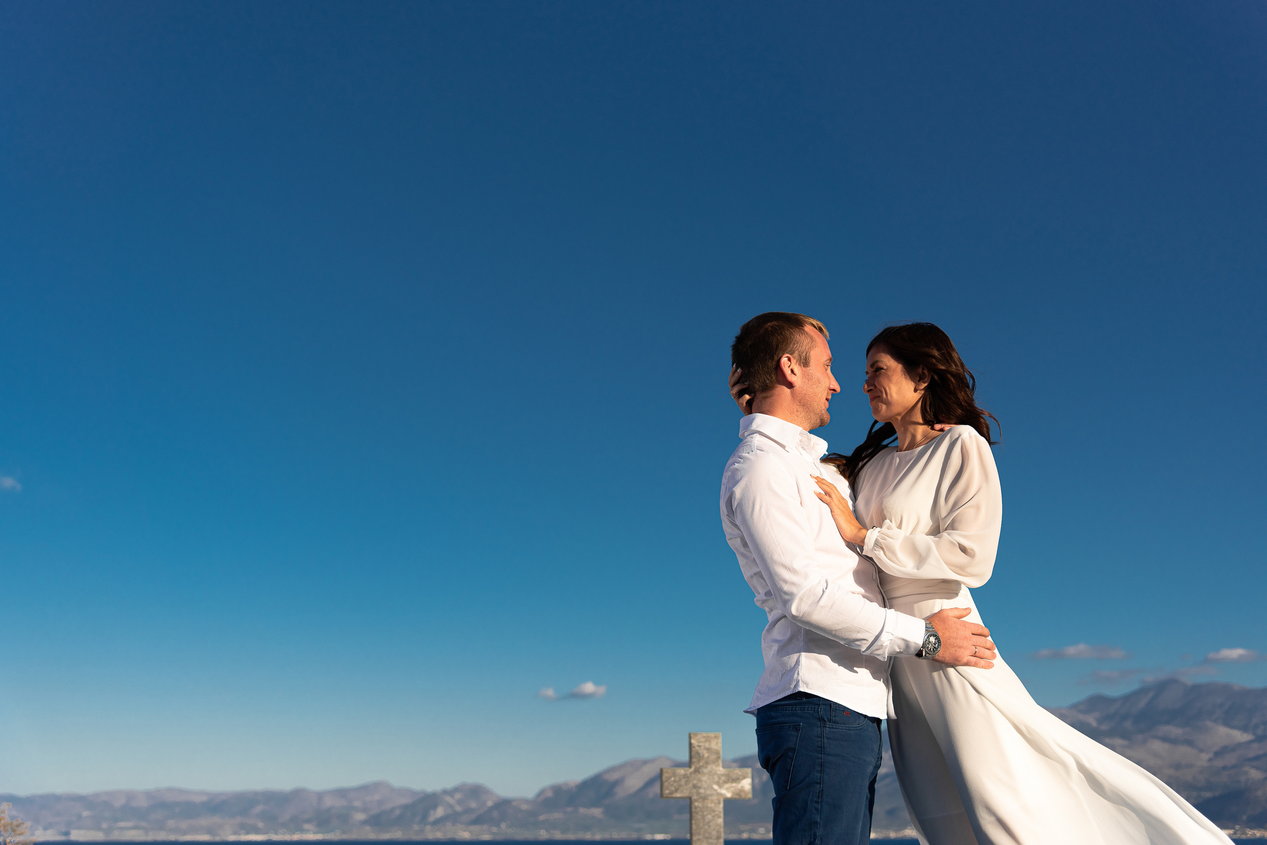 Newlyweds on a blue sky background