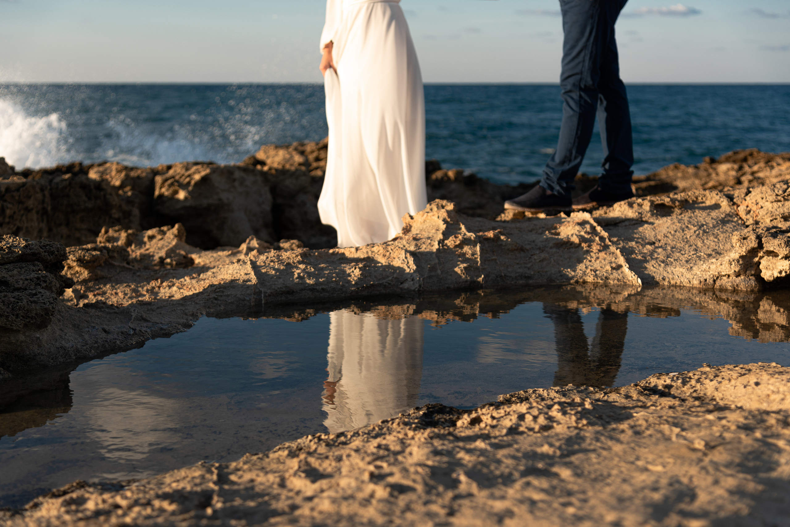 Photo shoot in Heraklion couple standing by the water