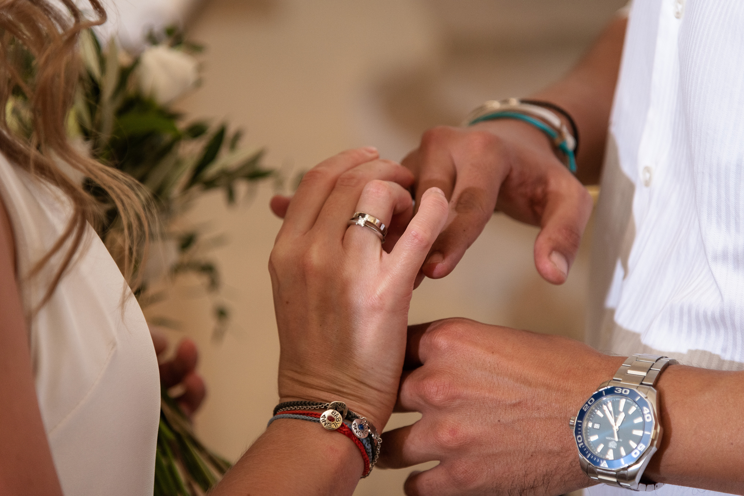 Wedding in Crete the bride puts a ring on the groom's finger