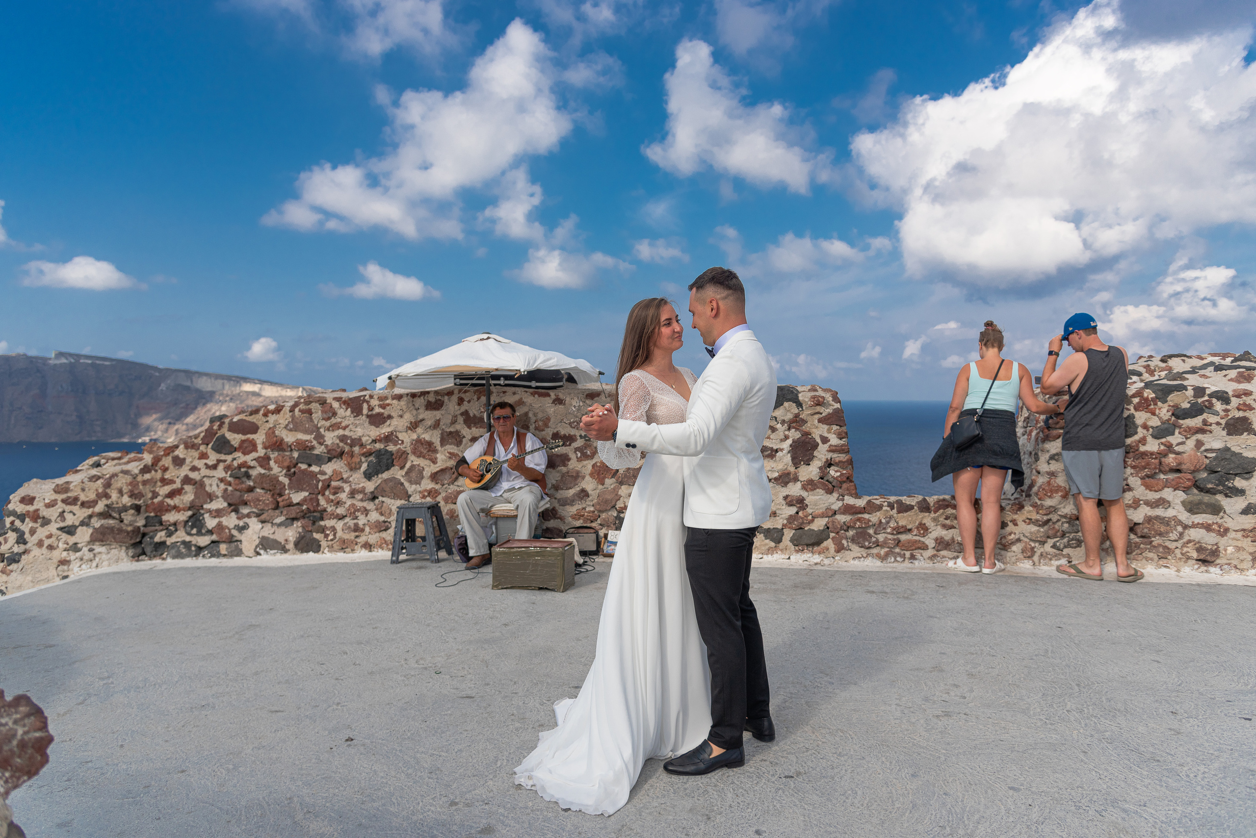 Bride and groom dancing in Santorini