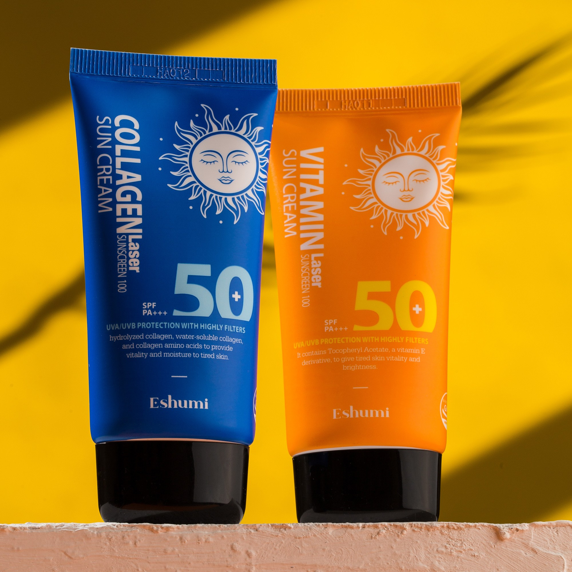 Eshumi SPF 50+ Collagen və Vitamin Laser Sun Cream günəş kremləri, sarı fon və kölgə effekti ilə yanaşı təqdimat.