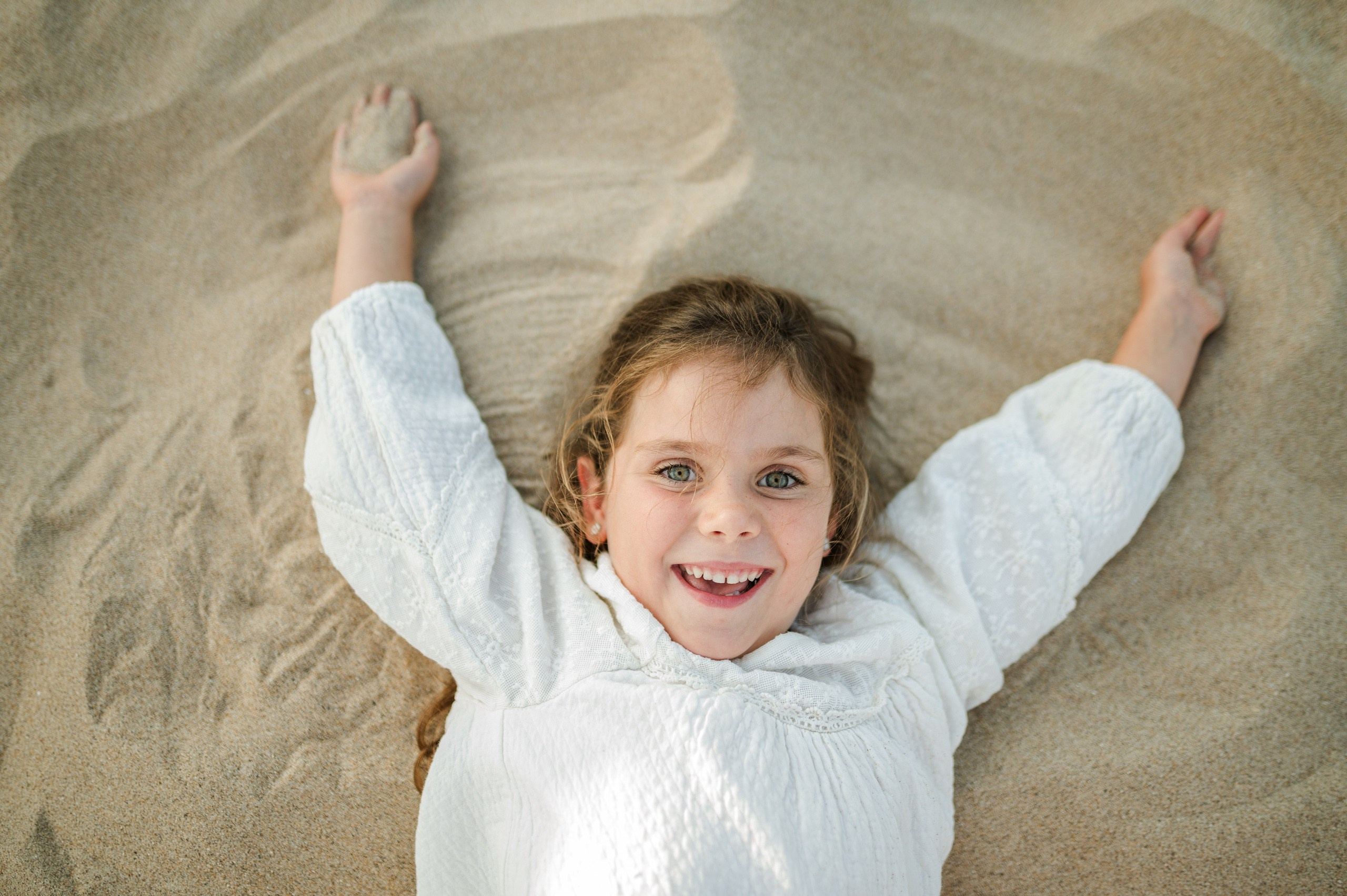 Family photo shoot for mum and daughter on Guincho beach, Portugal