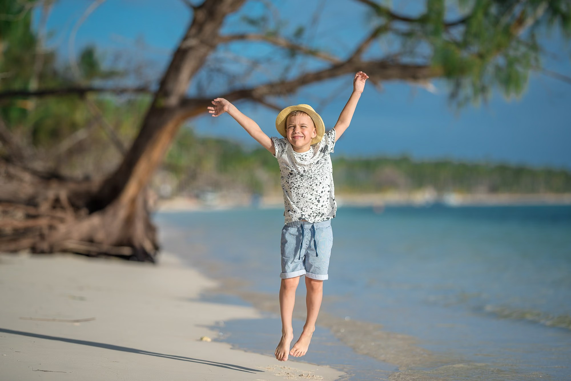 Happy family with two children enjoying a beach photoshoot in Punta Cana.