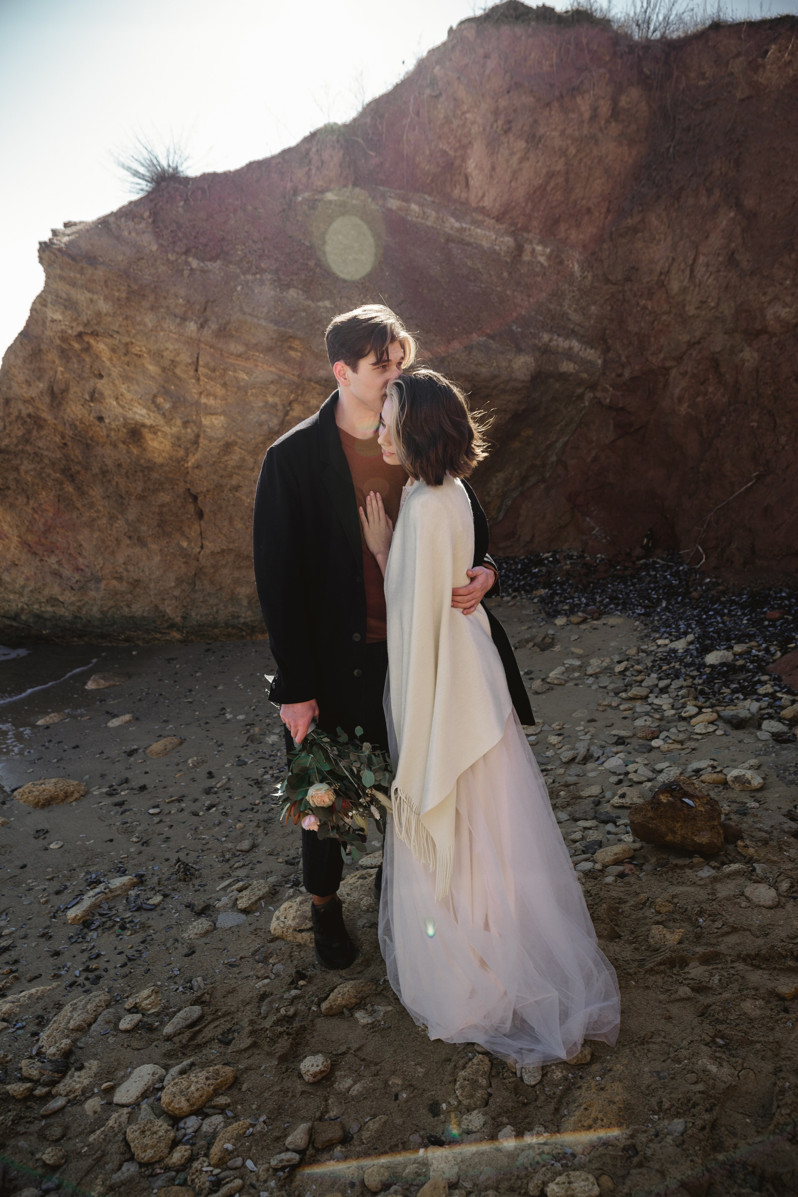 Couple enjoying seaside photoshoot in romantic Spain wedding