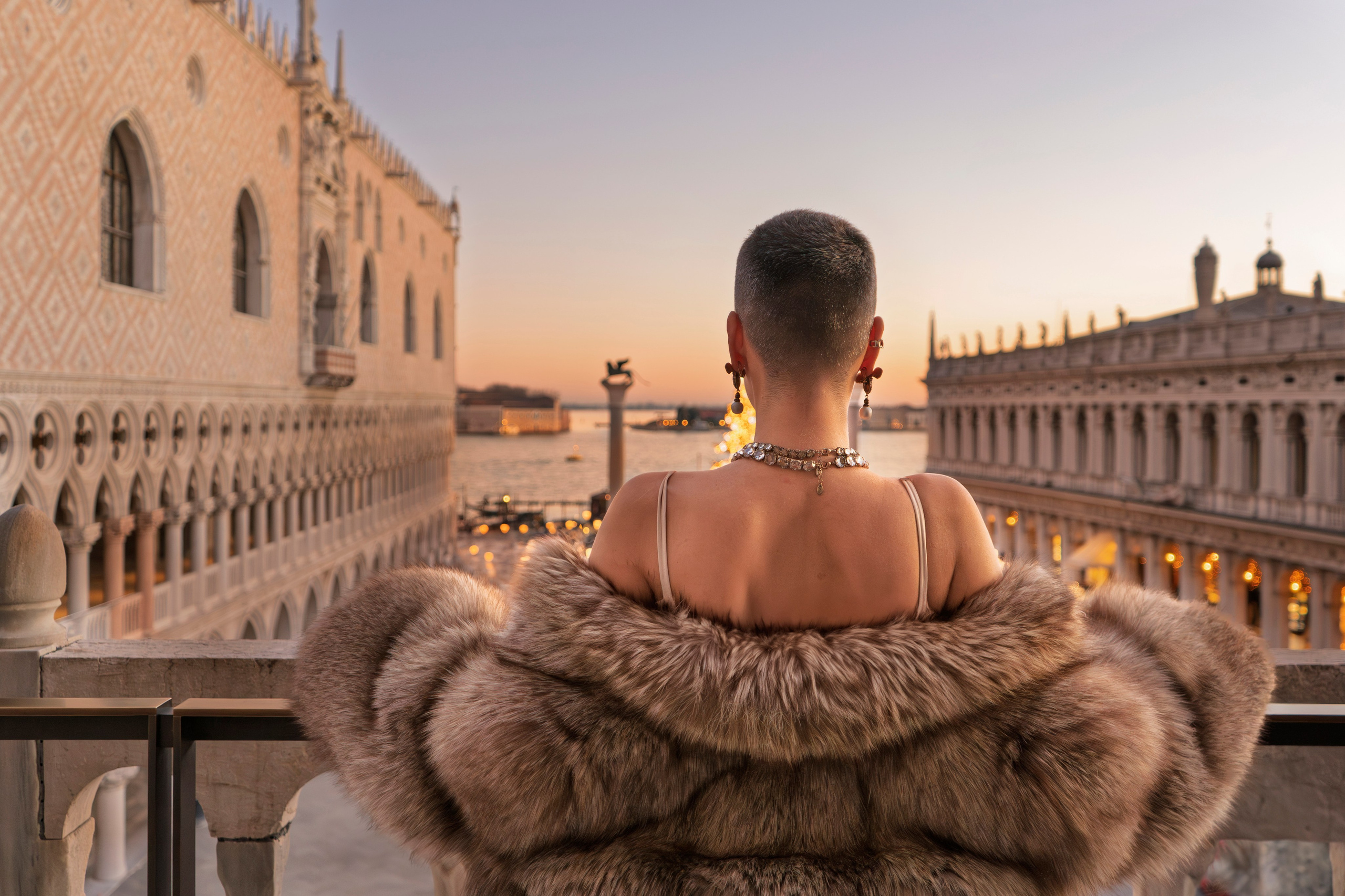  High-fashion photoshoot Venice with golden hour light near Piazza San Marco.