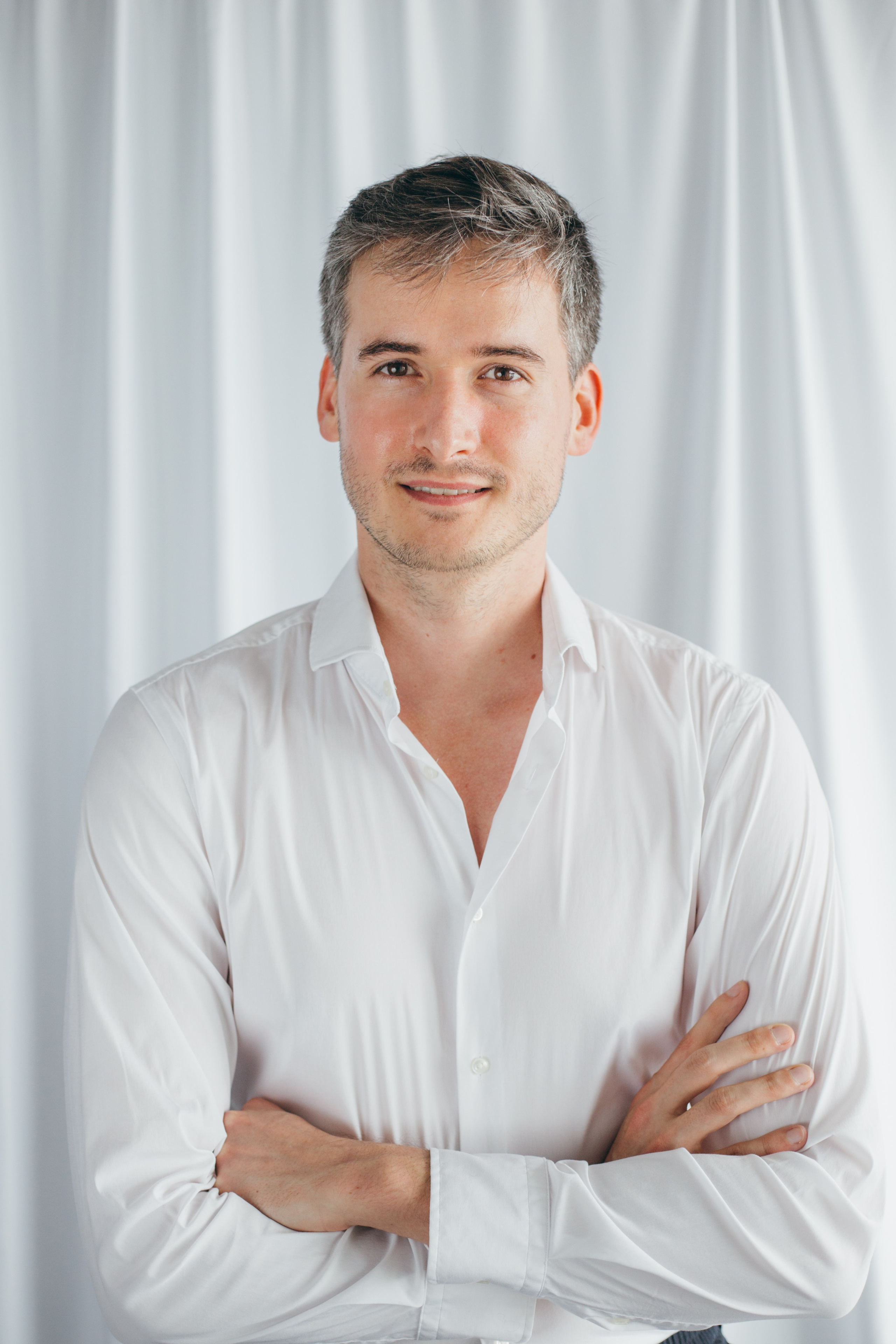 Portrait of a man in a white shirt for a photo CV