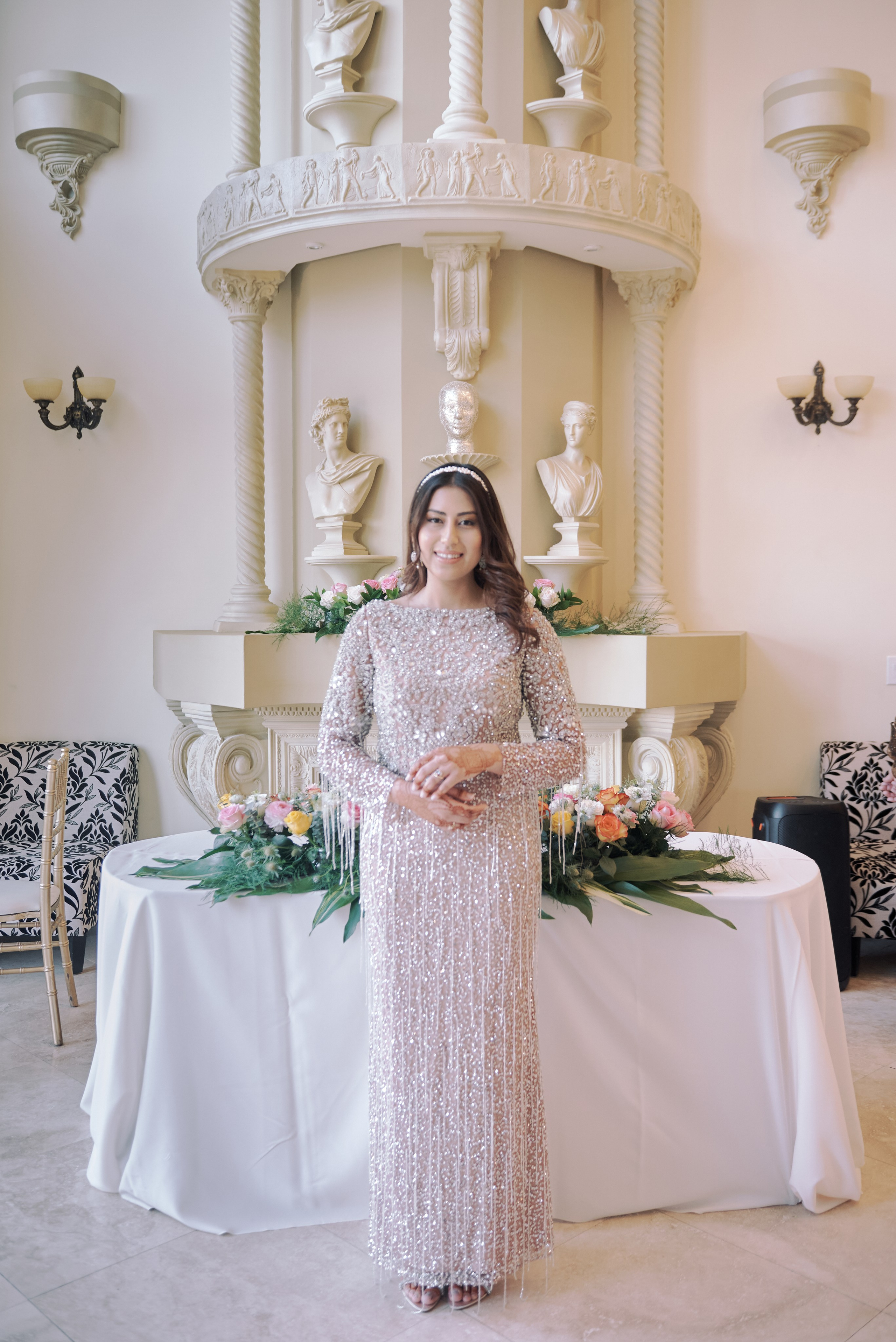 Engaged couple sharing a kiss on a scenic Los Angeles beach at golden hour